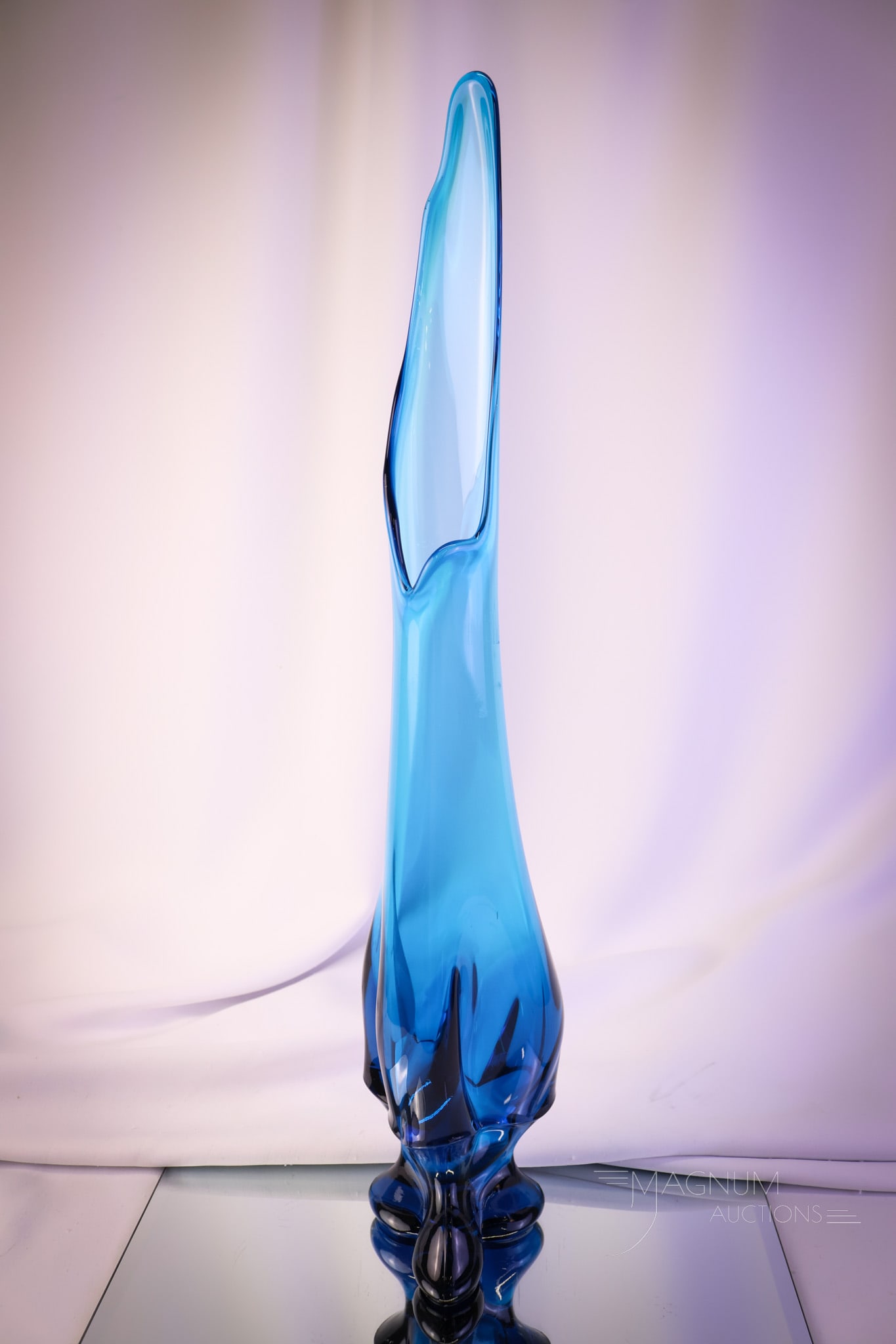Viking Epic Line Bluenique 3-Toed Swung Vase: A striking bluenique 21 1/2" tall Viking Epic line swung glass vase. This vase features a three-toed base. A nice find for your collection!