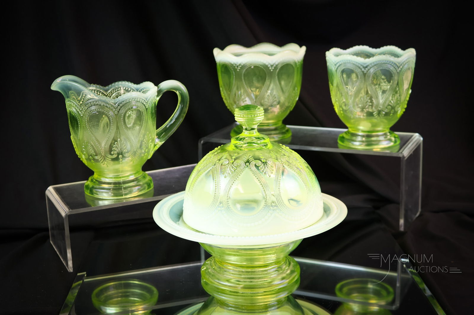 Northwood Uranium Vaseline Opalescent Victorian Glass Table Set: A wonderful Northwood Scroll with Acanthus pattern four-piece table set in uranium-rich vaseline opalescent glass. This fine set is quite elusive in vaseline. How nice to find all four pieces! The tal