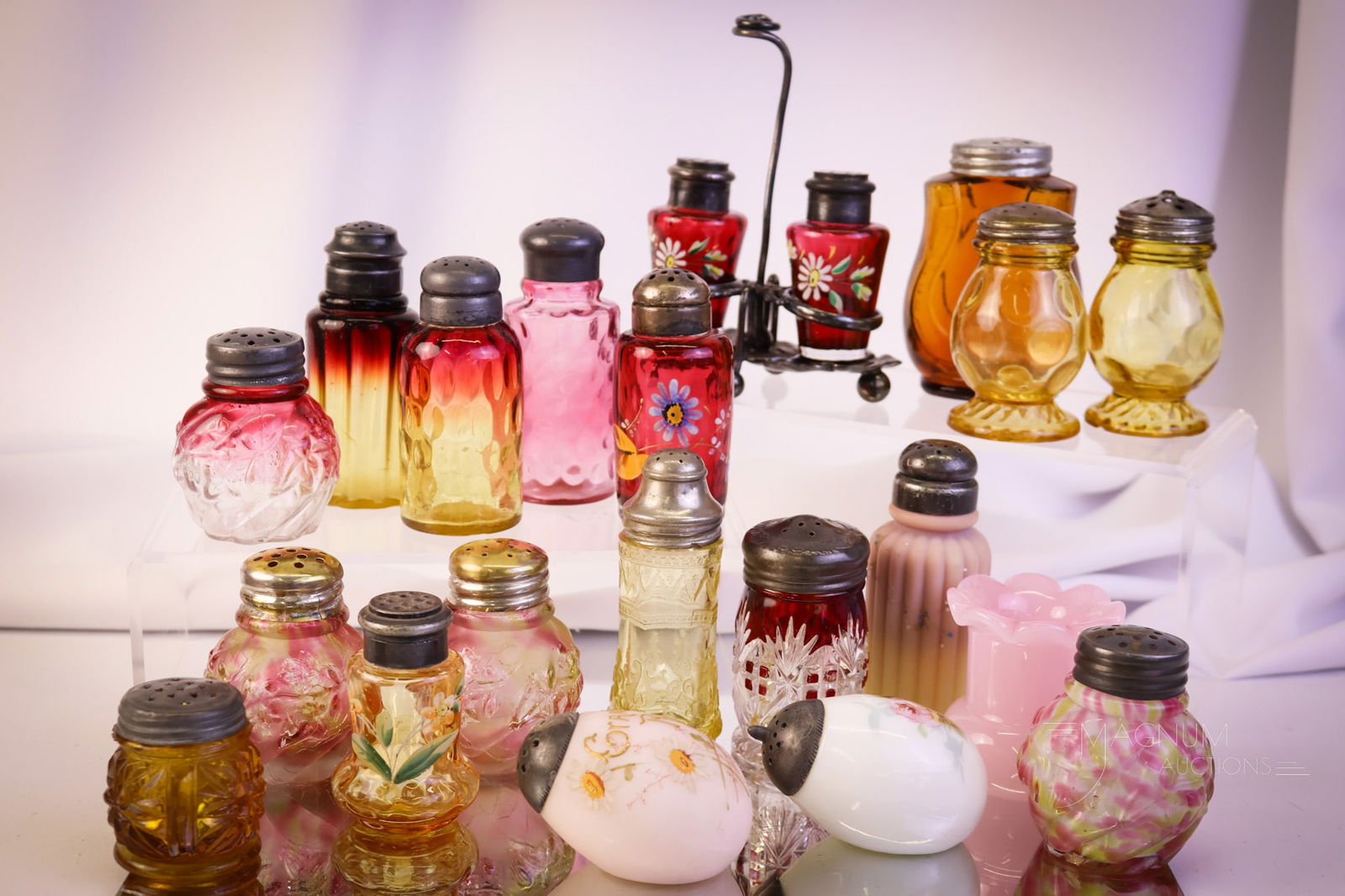 20 pc Lot Victorian Glass "Shakerama" Lot Northwood Cranberry Amberina & More: Twenty shakers to talk about in this lot. This lot has so much to offer. You'll definitely want to make sure you bid on this one! There are twenty examples, including cranberry, amberina, Northwood, M