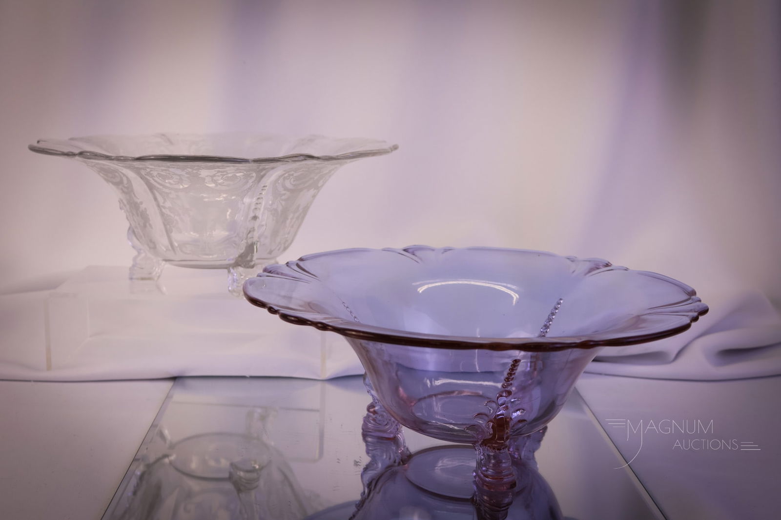 2 pc Lot Heisey Glass Bowls Alexandrite & More: Two beautiful examples of Heisey Glass bowls for your bidding pleasure. The first is a clear Empress pattern with Tea Rose etching. The second is an Alexandrite console bowl. The tallest measures 4 1/