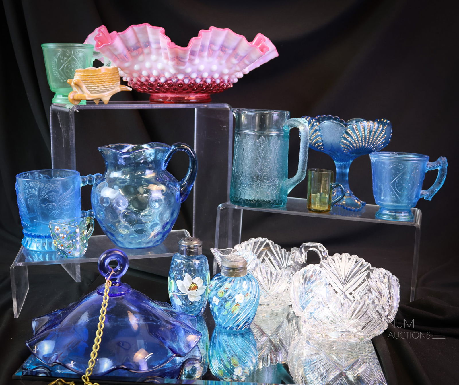 15 pc Lot Smoke Bell Fenton Pattern Uranium Glass & More: A generous lot of fifteen pieces of glass that will bring a smile to your face. This lot includes a blue samke bell. A Fenton cranberry bowl. Examples in cut and art glass. A Marine green mug and a bl