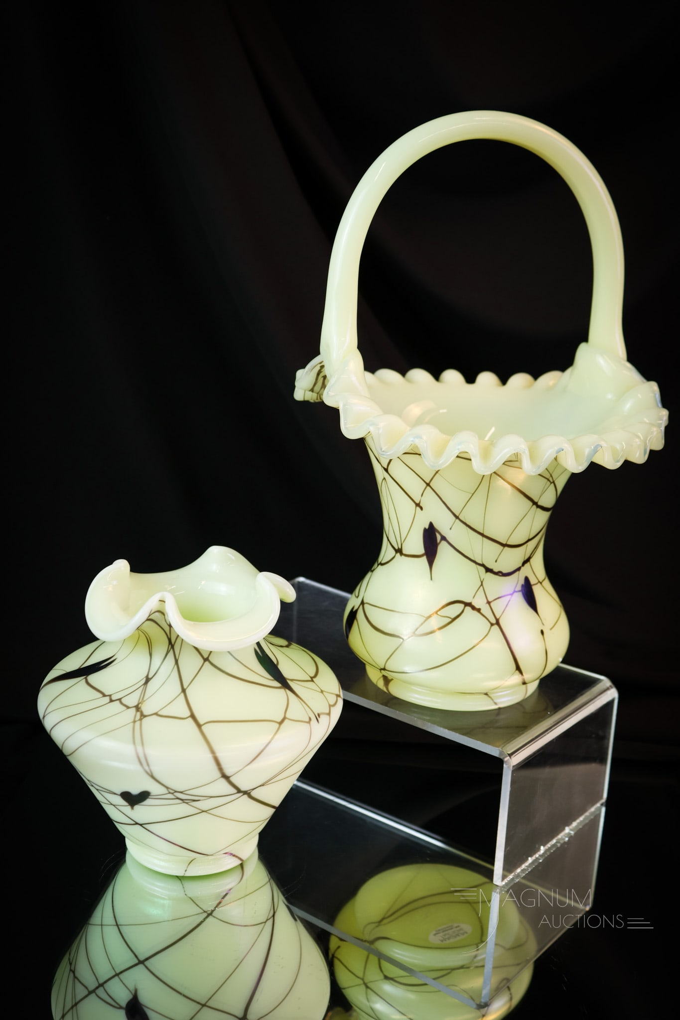 2 pc Lot Fenton Uranium Custard Hanging Heart Art Glass: Two beautiful and desirable pieces of Fenton custard uranium-rich art glass. Both pieces are decorated with hanging hearts. Both are marked "Fenton 1976". The tallest measures 10 1/2". SHIPPING NOTICE
