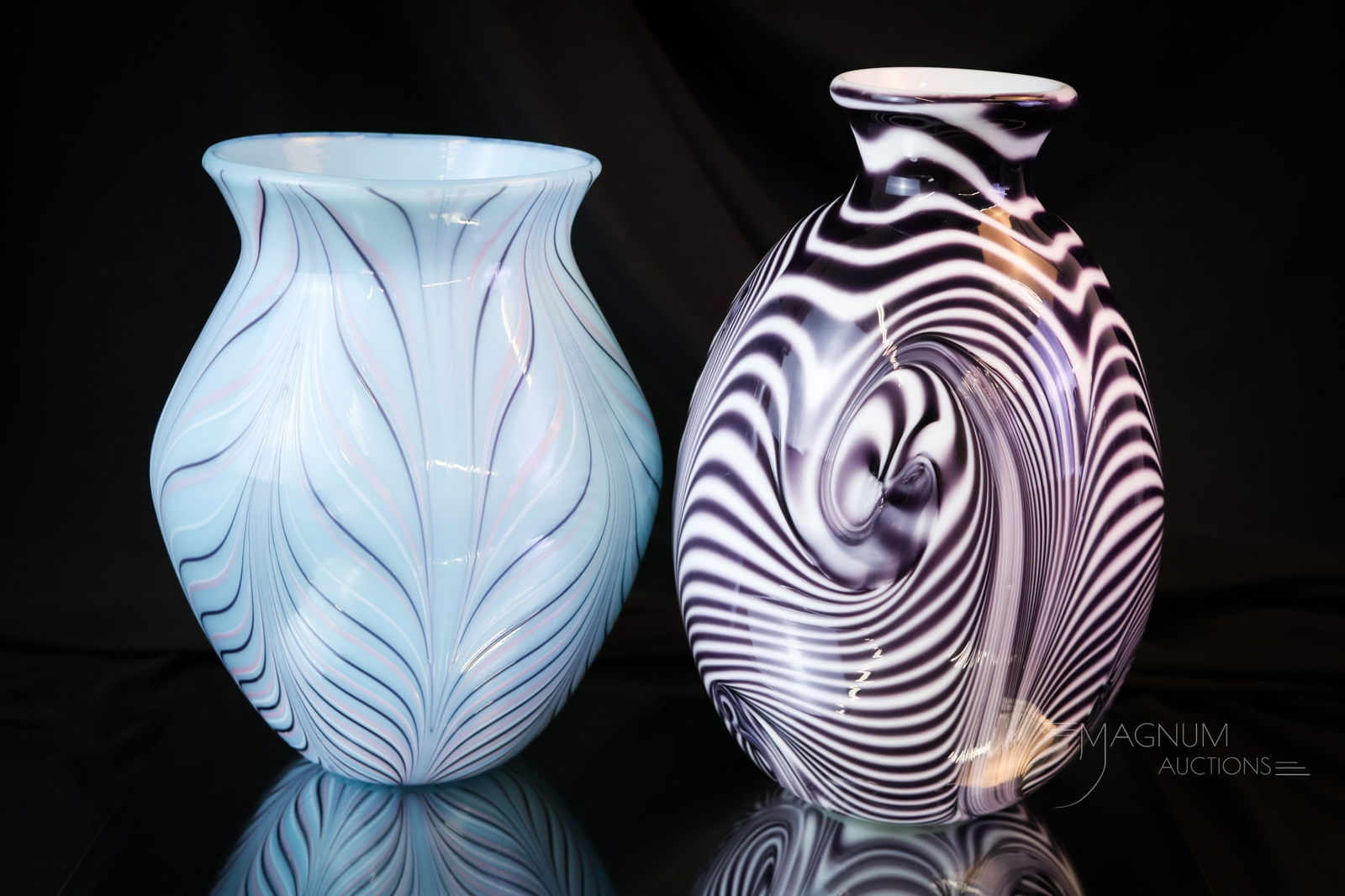 2 pc Lot Fenton Robert Barber-Dave Fetty Art Glass Vases: Two distinct finds in Fenton Art Glass vases by Robert Barber and Dave Fetty. The first is a blue pulled feather numbered "689/1000", and "Fenton 1976 and DLF". The second vase is a purple labrinth ex