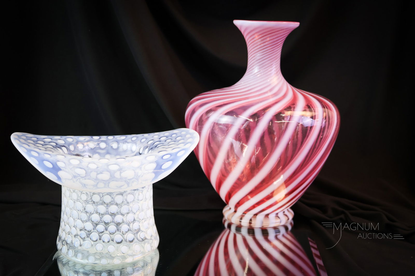2 pc Lot Fenton Art Cranberry Opalescent Scarcities: Two desirable and scarce finds in Fenton Art Glass. Both of these are in cranberry opalescent glass. The first is a large vase in the Swirl pattern. The second is a large hat in the Polka Dot pattern.