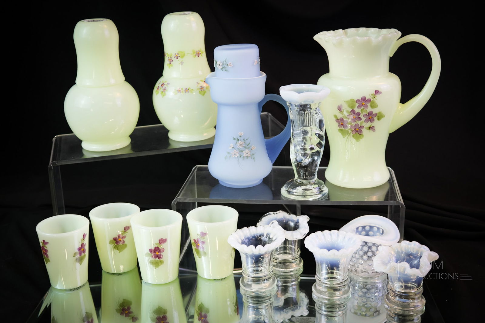 14 pc Fenton Uranium Custard Child's Miniature Art Glass: Fourteen delicious finds in children's or miniature Fenton Art Glass. All of the pieces are made in uranium-rich custard glass. The lot includes a five-piece water set decorated with violets. A tumble