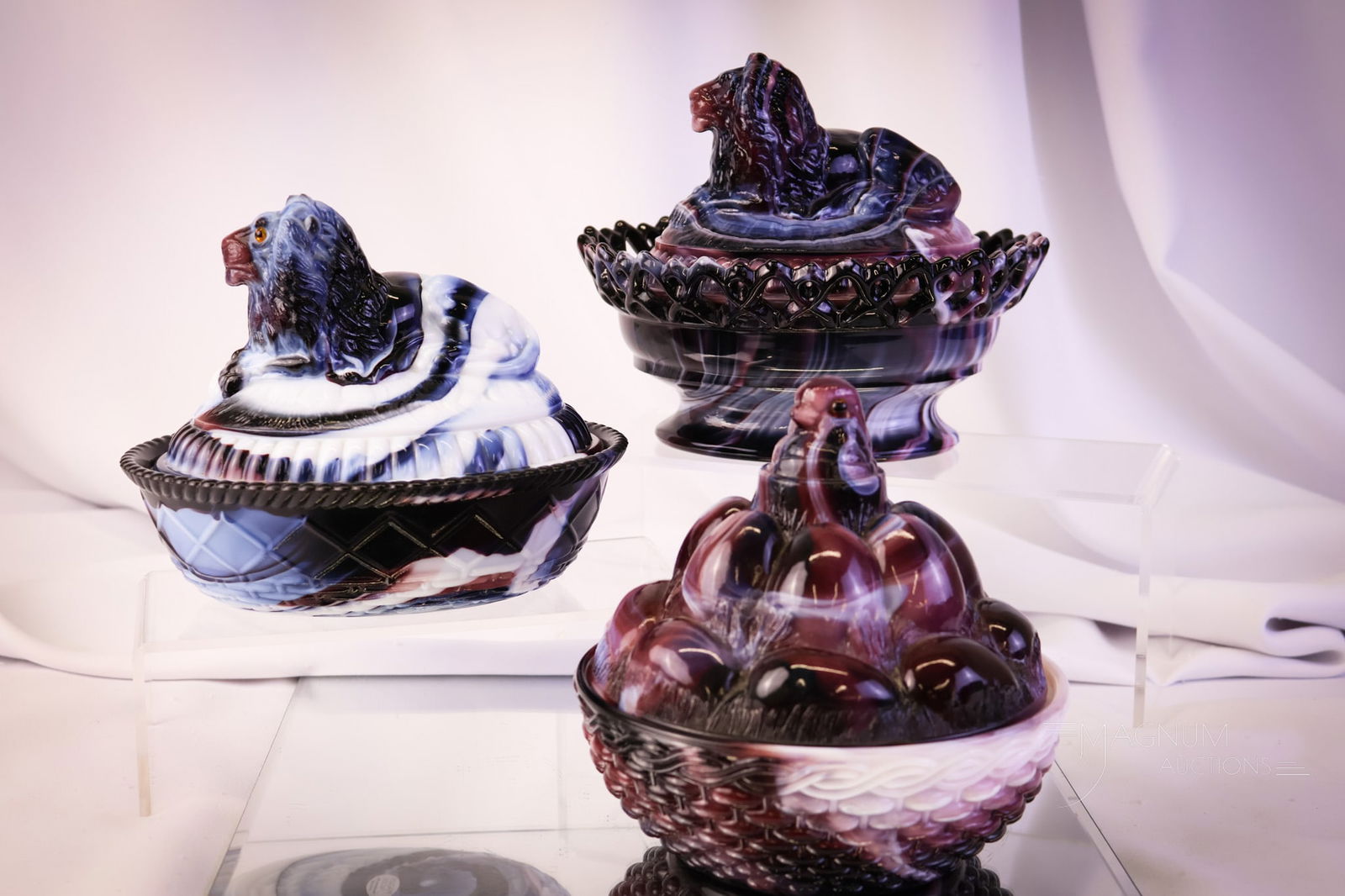 3 pc Lot Westmoreland & Imperial Purple Slag Glass Covered Dishes: Three unique finds in purple slag-covered dishes. Two are Westmoreland. One is Imperial glass. The tallest measures 6 1/2" tall. SHIPPING NOTICE: If you choose not to utilize the LiveAuctioneers LiveS