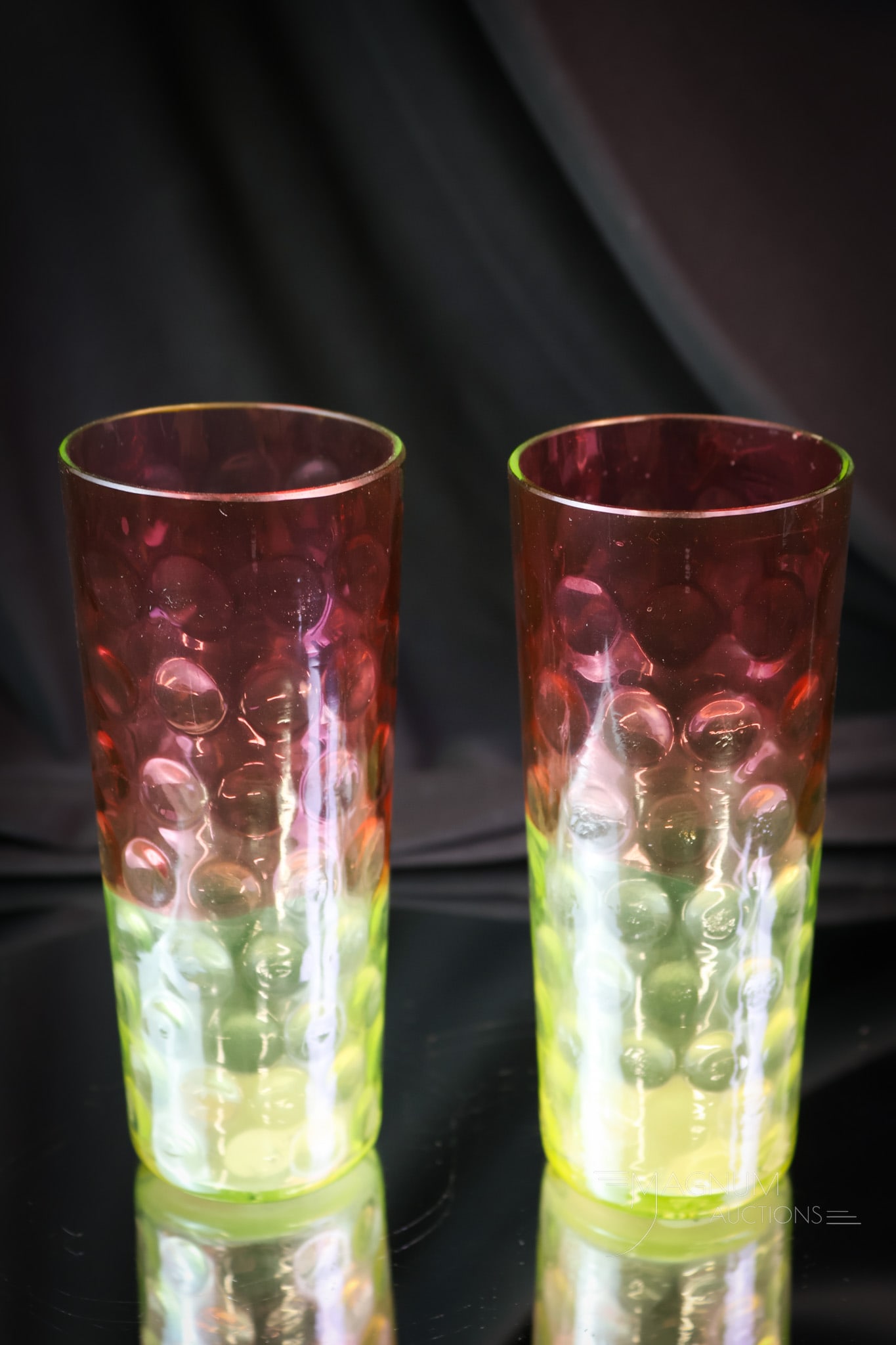 2 pc Lot Hobbs Cranberry Uranium Vaseline Victorian Glass Lemonade Tumblers: A select offering of two Hobbs cranberry to uranium-rich vaseline glass Victorian lemonade tumblers. These are exceedingly rare and match the tankard pitcher in the previous lot. Make sure you win the