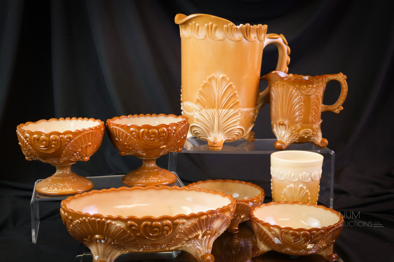 8 pc Lot Victorian Chocolate Glass Greentown & McKee: Eight pieces make up this generous offering of Victorian chocolate glass. The lot includes a Greentown Leaf Bracket water pitcher and tumbler. The remaining six pieces are McKee, including two small b