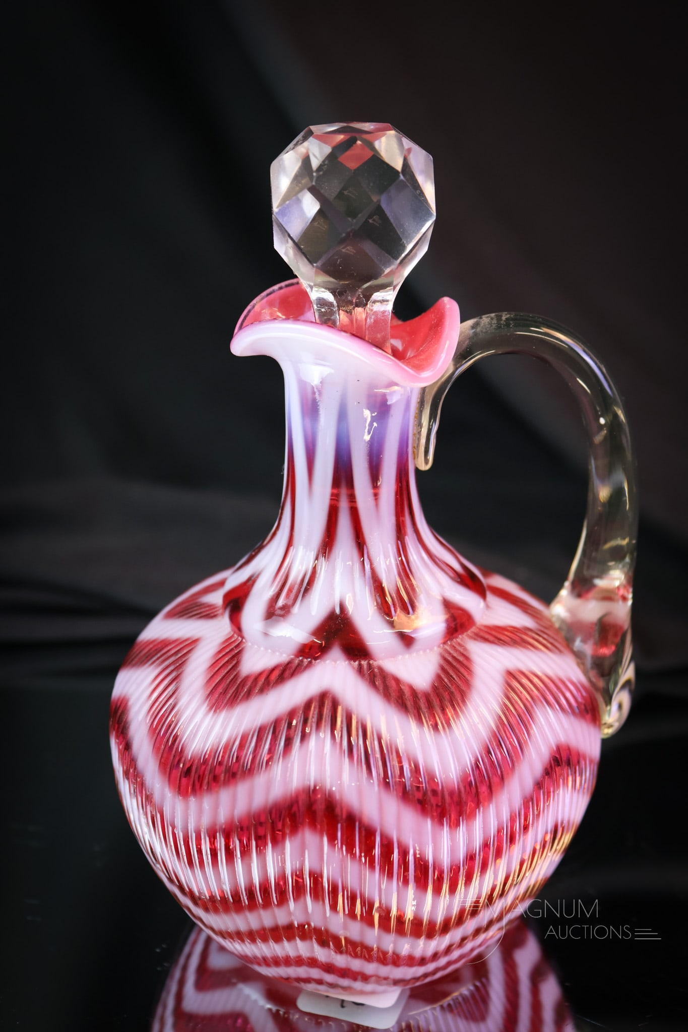 Northwood Cranberry Opalescent Ribbed Herringbone Victorian Cruet: A fine, fine example for your Victorian glass collection. This cruet has perfect coloring and bright white opal. What a nice find! The cruet measures 6 1/2" tall. SHIPPING NOTICE: If you choose not to