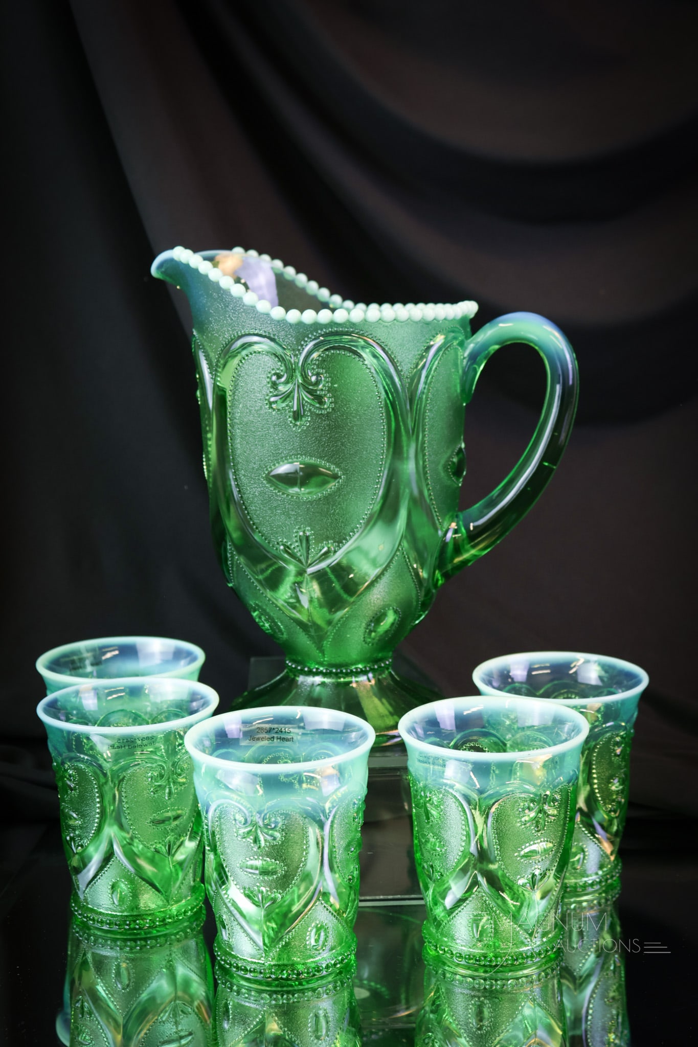 6 pc Dugan Jeweled heart Green Opalescent Victorian Water Set: A wonderful green opalescent Dugan Jeweled Heart pattern Victorian water set. This set consists of a pitcher and five tumblers. The tallest of the offering measures 9". SHIPPING NOTICE: If you choose