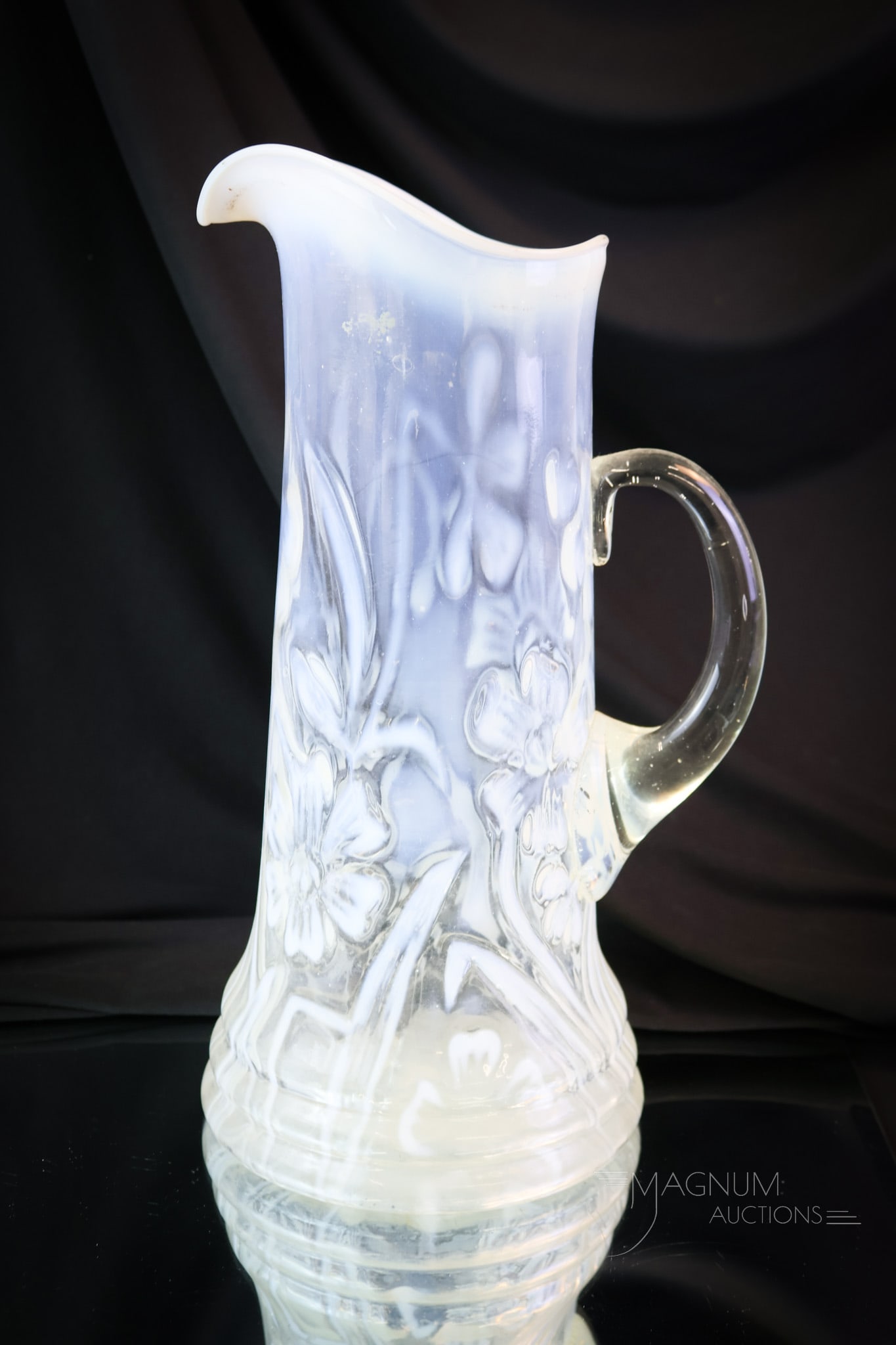 Northwood Victorian Opalescent Daffodils Glass Tankard Pitcher: What a scarce find this beauty is! This is a Northwood Daffodils pattern Victorian tankard water pitcher. Seldom do you see it in white opal. This one is extraordinary. The tankard measures 12 1/4" ta