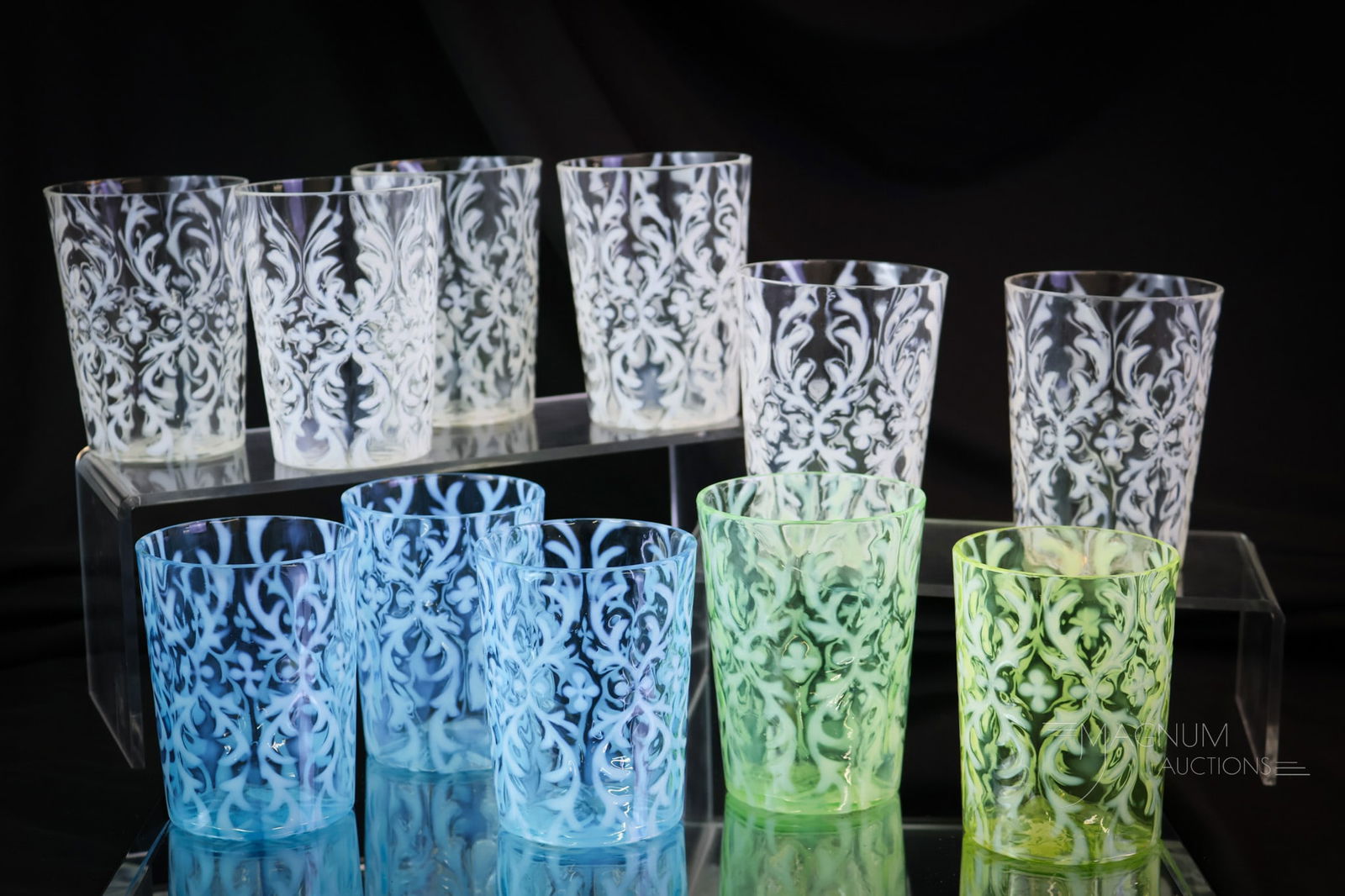 11 pc Lot Victorian Northwood Opalescent Glass Uranium & More Tumblers: Eleven examples in a variety of colors in Northwood's Spanish Lace pattern tumblers. There are three blue, one green, one vaseline, and six white. The tallest measures 3 3/4". All of the blue tumblers