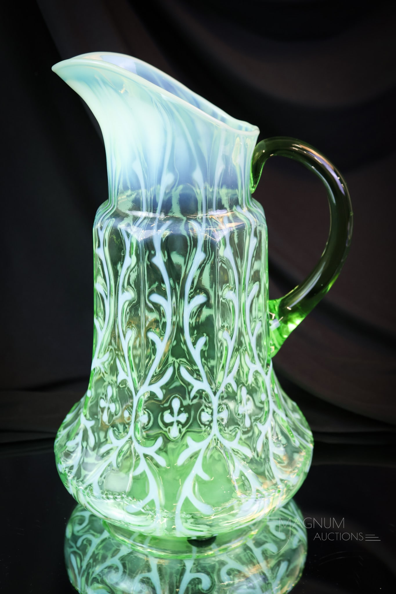Northwood Uranium Green Opalescent Victorian Glass Spanish Lace Tankard Pitcher: A wonderful Northwood uranium-rich green opalescent Spanish Lace tankard pitcher. This super example measures 11 1/2" tall and has very good coloring and opal. It glows brightly under black light. SHI