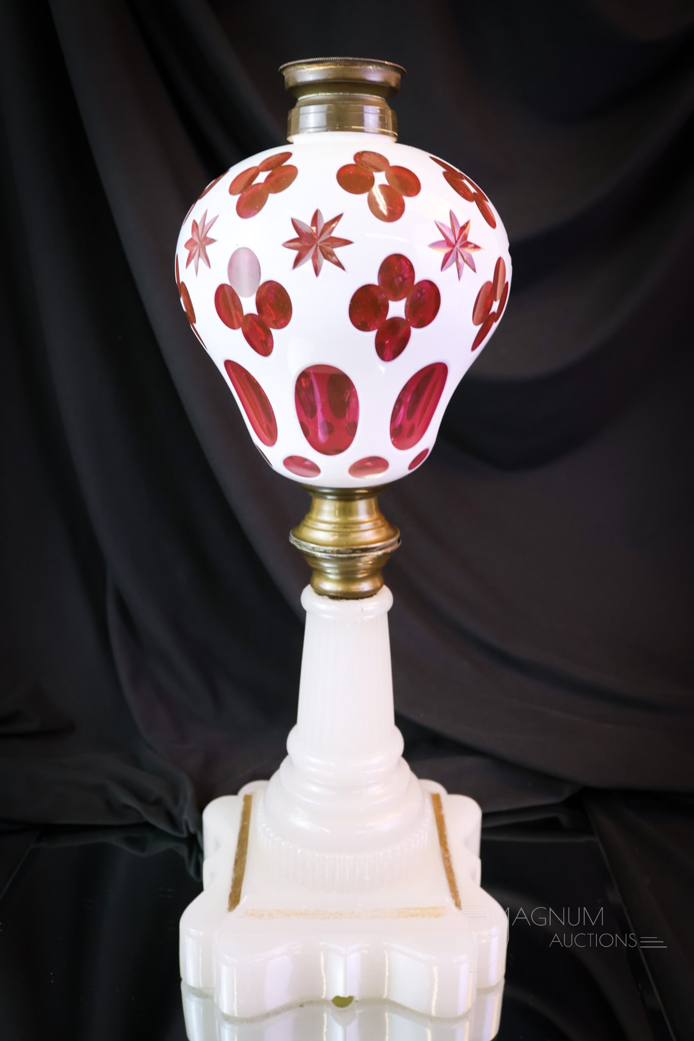 Victorian Cranberry Cut Overlay Sandwich Glass Oil Lamp: Another beautiful Victorian cut overlay oil lamp attributed to Sandwich Glass. This lamp measures 16" tall to the burner collar and 6" wide. The lamp features a cranberry cut overlay font with a star