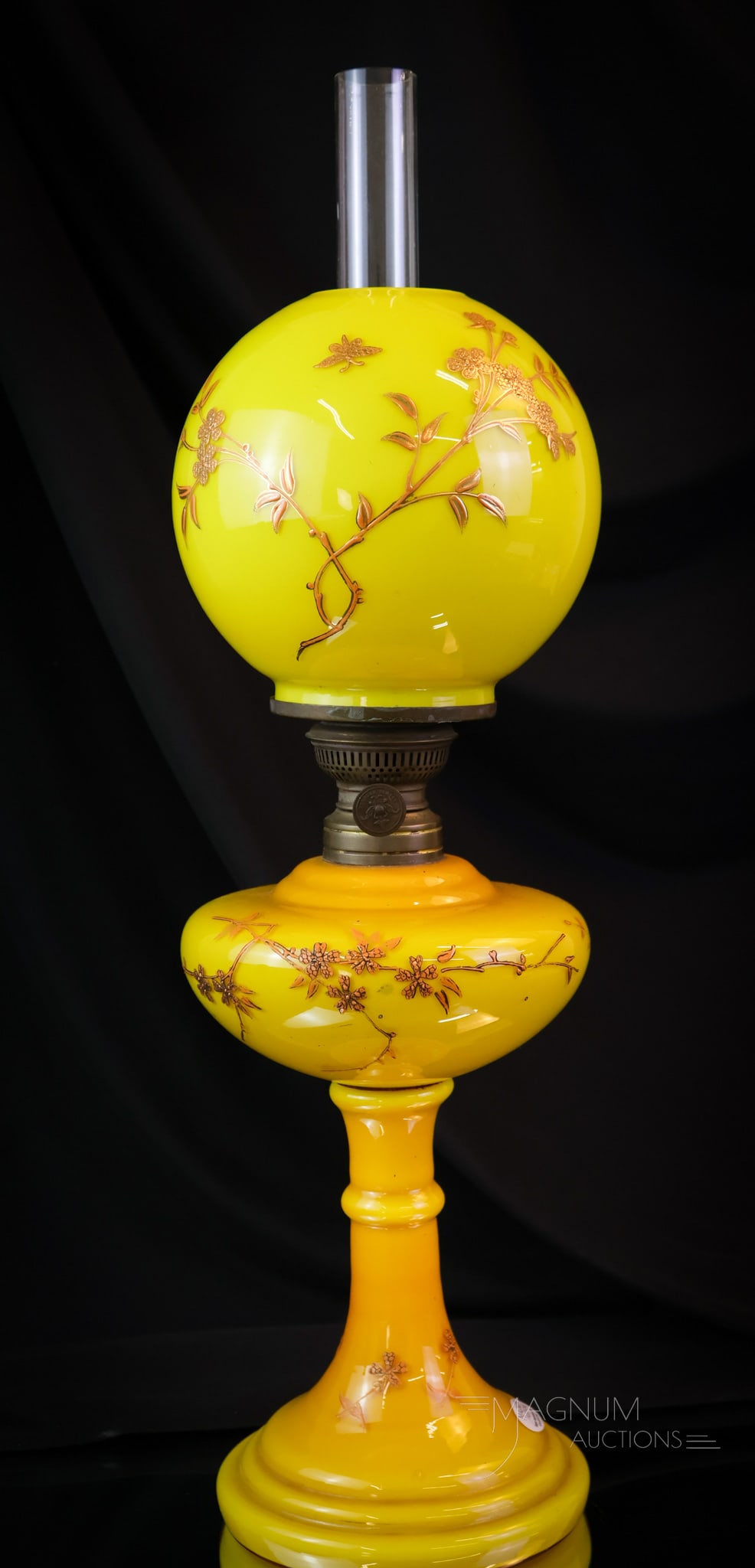 Victorian Yellow Cased Gilt Enameled Victorian Junior Banquet Lamp: This is a gorgeous Victorian cased glass junior oil lamp. This lamp is being re-listed due to a non-paying bidder. This lamp is decorated with gilt and enameled floral around the body. The lamp retain