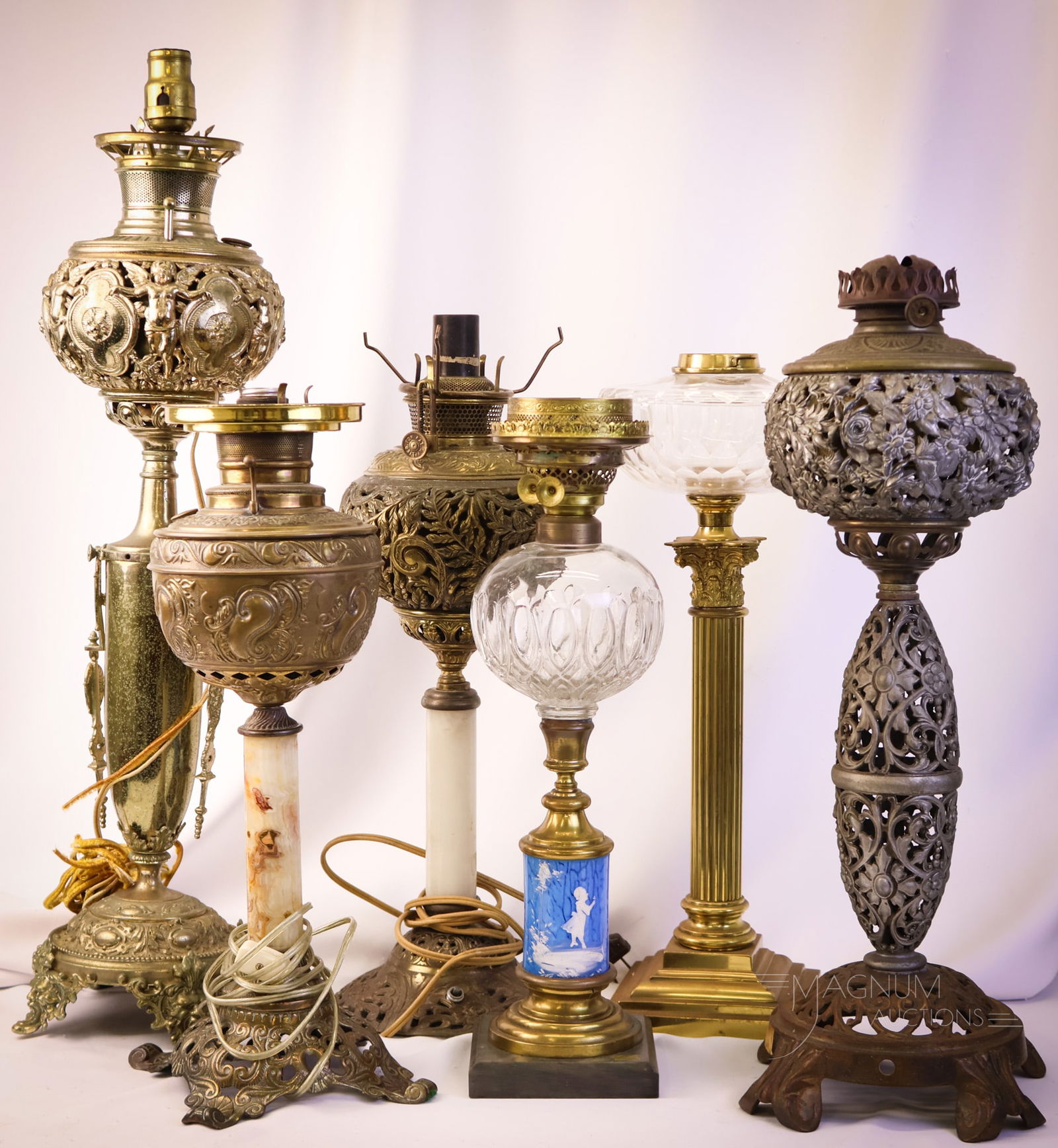 6 pc Lot Victorian Banquet Parlor Oil Lamp Bases: Six nice finds in Victorian parlor banquet oil lamp bases. This lot includes a Bradly & Hubbard with a Cherub design. A B & H with filigree, and a third with floral filigree. There is an English brass