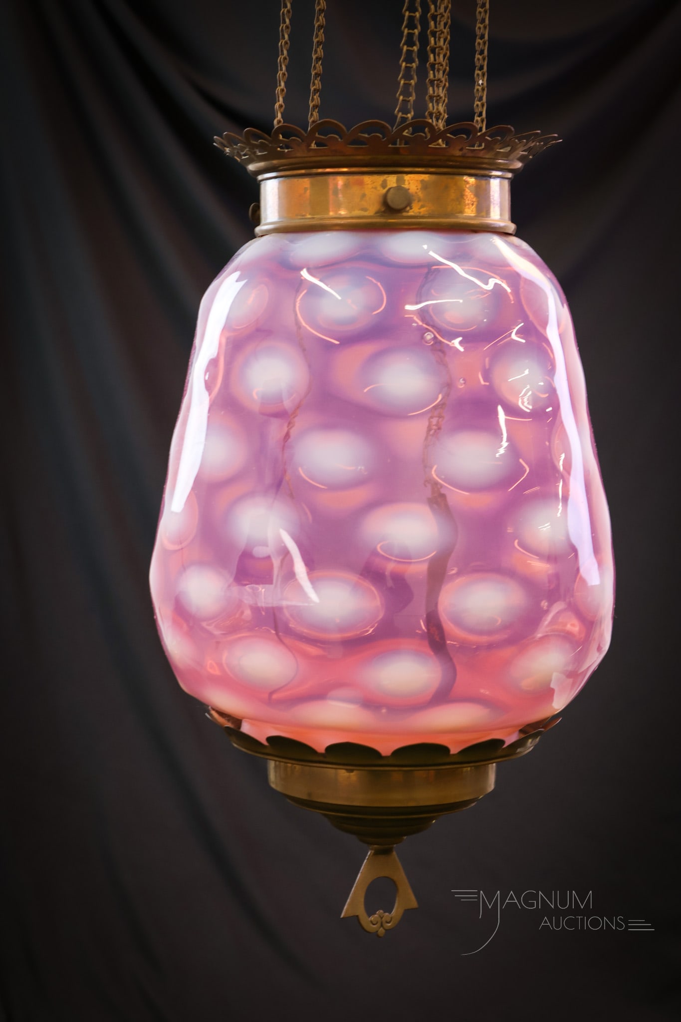 Cranberry Opalescent Victorian Glass Hanging Hall Lamp: A striking Victorian hanging hall candle lamp. This lamp features a cranberry opalescent Bulls-eye pattern shade. The lamp measures 34" long and 9" wide. SHIPPING NOTICE: If you choose not to utilize