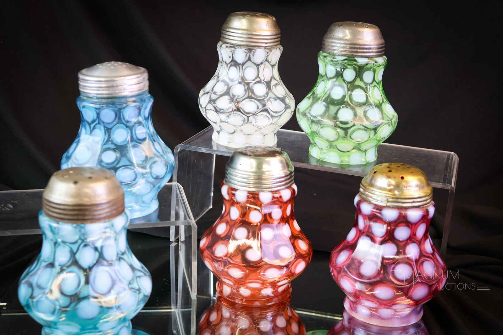 6 pc Lot Victorian Northwood Glass Sugar Shakers: Six delightful colors of the Northwood Nine-Panel pattern Coinspot Victorian sugar shaker are present in this lot. This lot includes green, white, light blue, dark blue, cranberry, and bittersweet. Ea