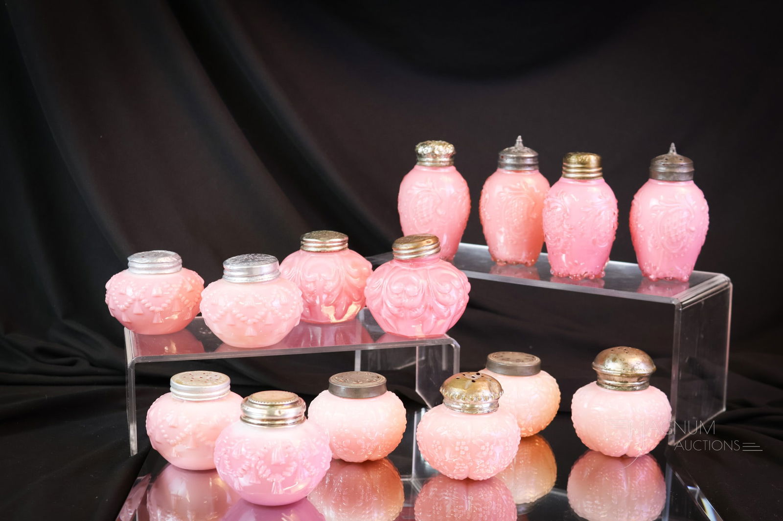 14 pc Lot Victorian Pretty in Pink Consolidated & Challinor Salt Shakers: Oh, now this is a nice lot. Look at all of the pink shakers. There are fourteen in all. In pink cased and opaque glass. Makers include Consolidated and Challinor. The tallest measures 3 1/4". SHIPPING
