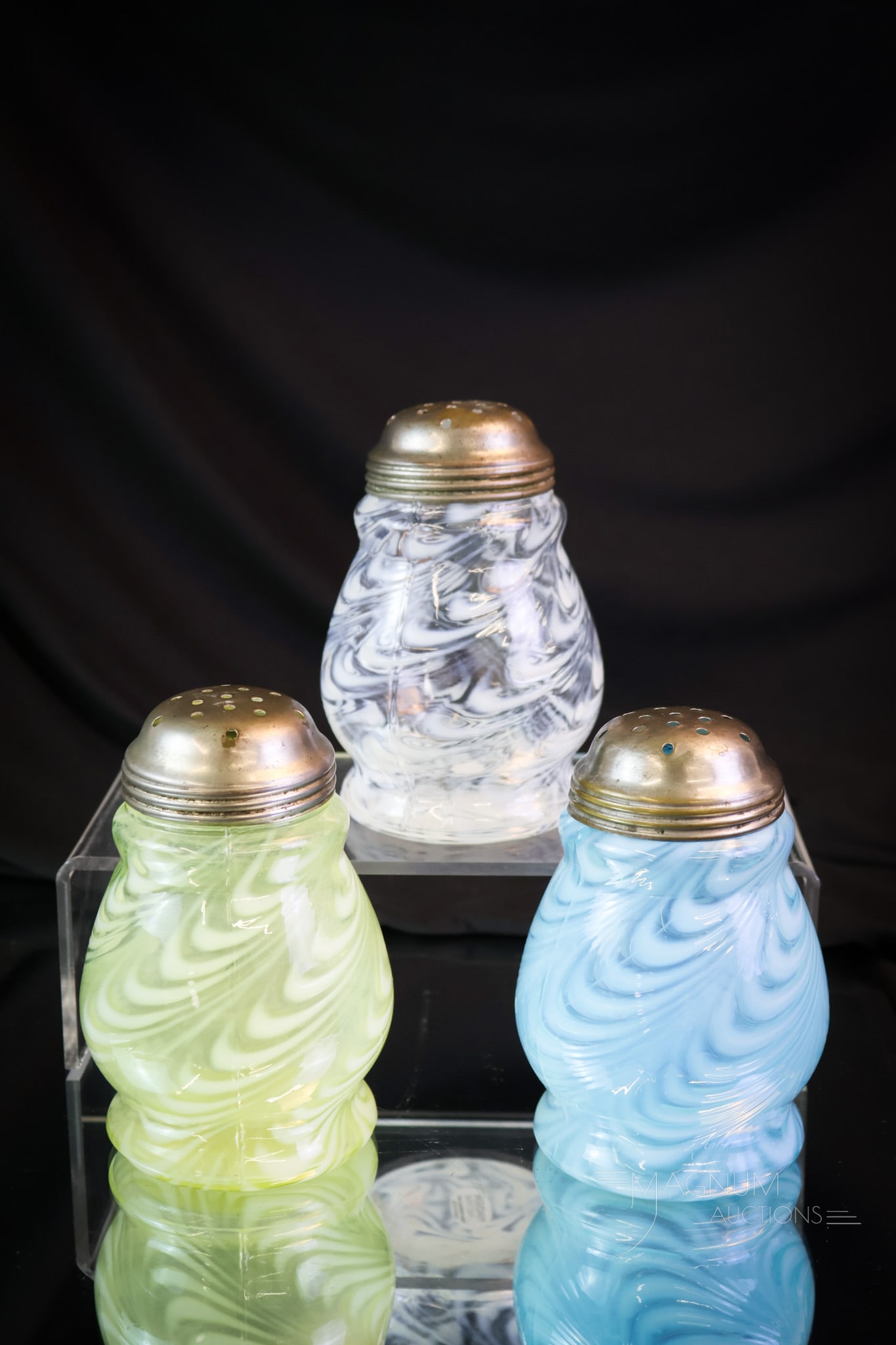3 pc Lot Northwood Victorian Opalescent Glass Sugar Shakers Vaseline Uranium & More: Three examples of Northwood Victorian glass Blown Twist pattern sugar shakers. One in blue. One in white opal. The last in uranium-rich vaseline. Each measures 4 1/2" tall. SHIPPING NOTICE: If you cho