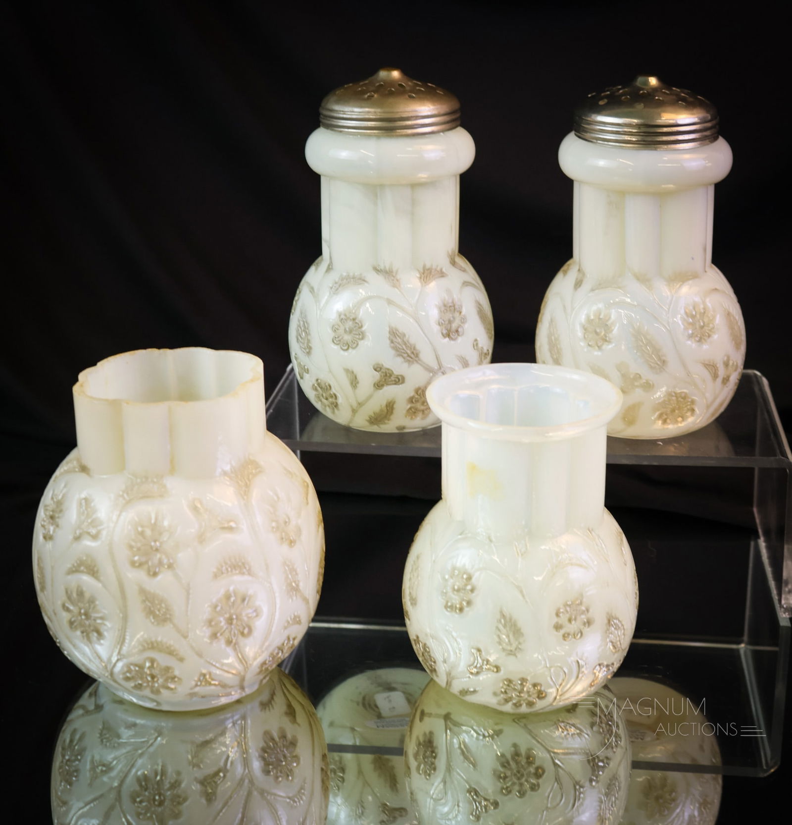 4 pc Lot Victorian Findlay Onyx Glass: Four selections to bring joy to your collection. This lot includes two sugar shakers, a vase, and a spooner. Each sugar shaker has a unique coloring. The spooner is just nice. The vase began life as a