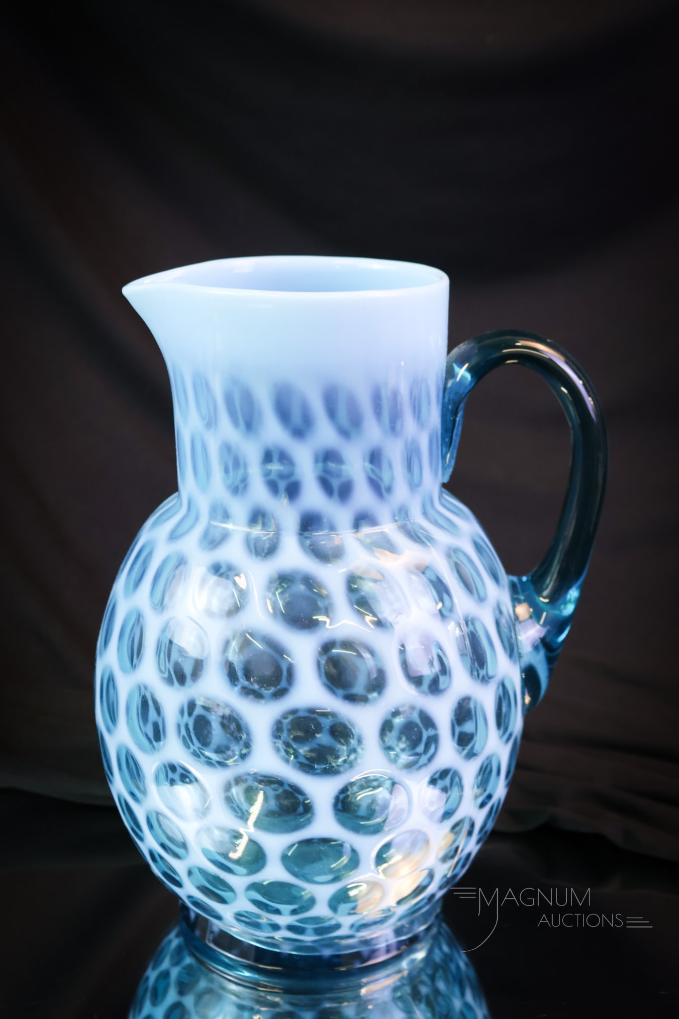 Scarce Blue Opalescent Big Windows Victorian Glass Water Pitcher: A scarcely found Victorian opalescent water pitcher. This pitcher is in the Big Windows pattern. The pitcher has great color and opal. The pitcher measures 9" tall and 6 1/2" wide. SHIPPING NOTICE: 