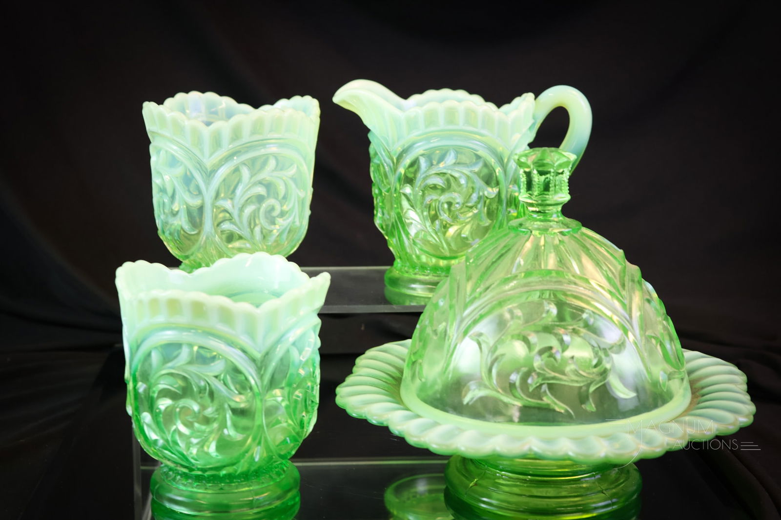 4 pc Uranium Dugan Green Opalescent Victorian Glass Circle Scroll Table Set: A complete four-piece uranium-rich Victorian Dugan table set in the Circle Scroll pattern. This set glows brightly under black light with its uranium-rich glass. The tallest of the set measures 6 1/2"