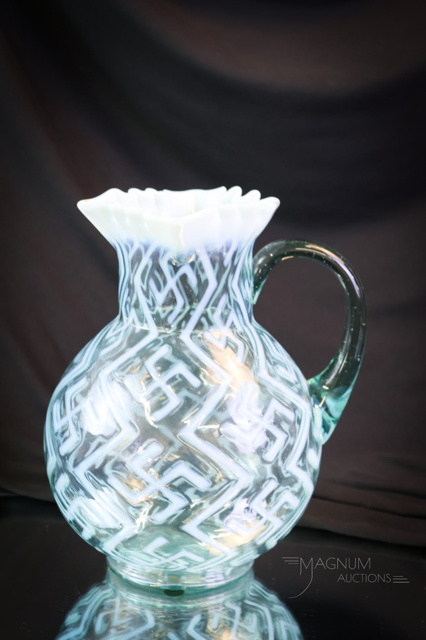 Rare Northwood Glass Swastika Blue Opalescent Victorian Glass Water Pitcher: A fantastic find in Victorian opalescent glass. This pitcher is in the Swastika pattern. It was made by Northwood. Excellent color and opal abound on this piece. The pitcher measures 9 1/2" tall. SHIP