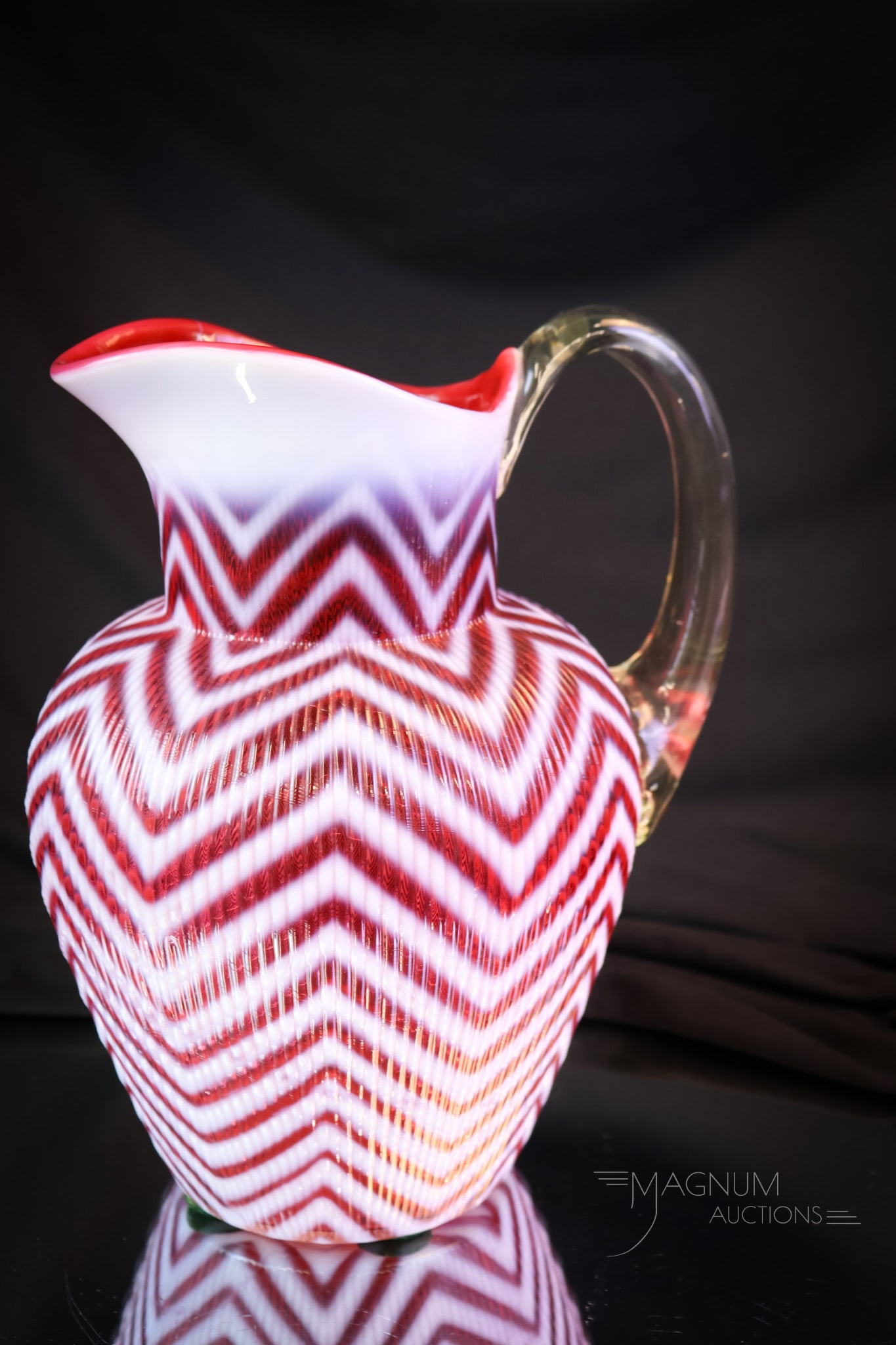 Scarce Northwood Cranberry Opalescent Ribbed Herringbone Glass Water Pitcher: A wonderful addition to any collection. This is a Northwood Ribbed Herringbone pattern pitcher. Extra nice opal and deep, rich cranberry coloring make this a must-have piece! The pitcher measures 8