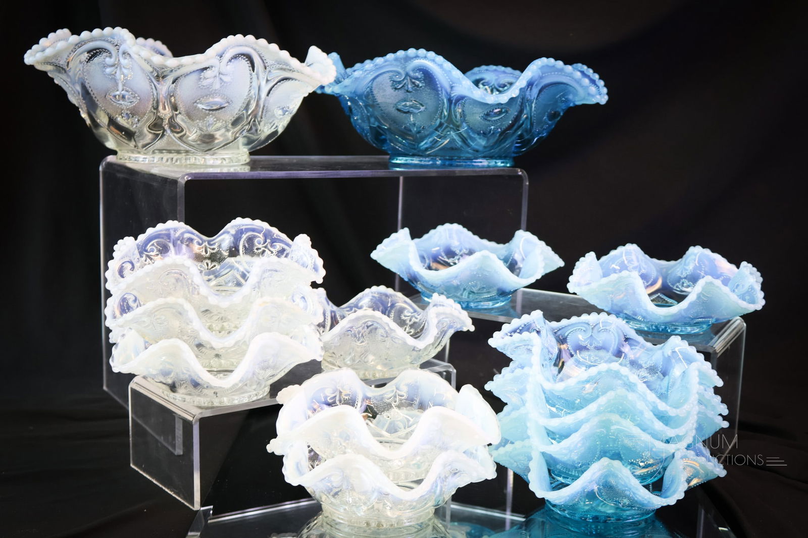 14 pc Opalescent Victorian Glass Berry Sets: Two complete seven-piece berry sets are found in this lot. This lot offers a blue and a white set in the Jeweled Heart pattern. The tallest of each set meaures 4". SHIPPING NOTICE: If you choose not t