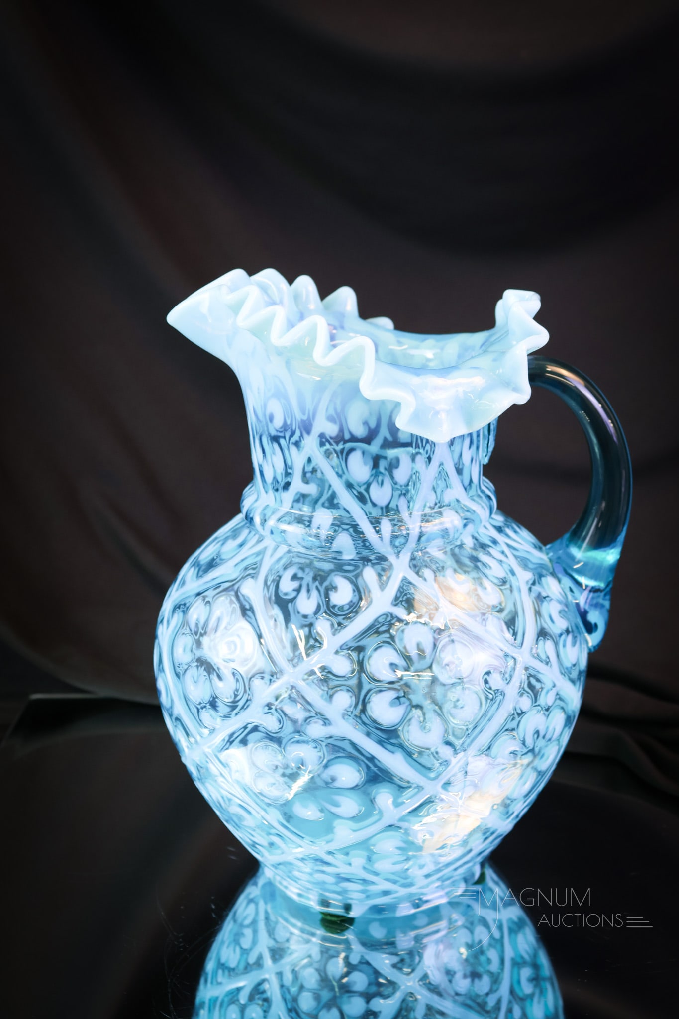 Victorian Blue Opalescent Daisy in Criss Cross Glass Water Pitcher: What a lovely find this pitcher is! This beautiful Victorian pitcher is a welcome addition to any collection! This pitcher is in the Daisy in Criss Cross pattern. This fine example measures 9 1/2" tal