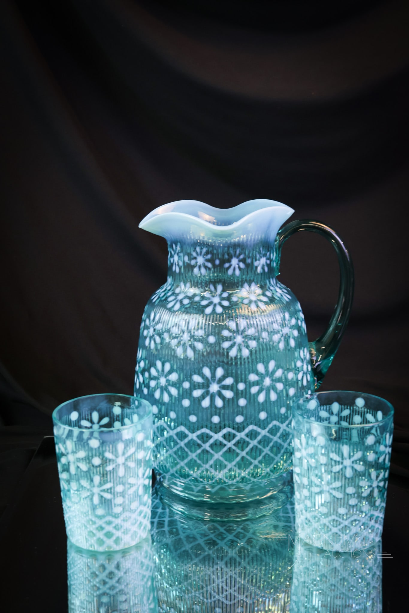 3 pc Northwood Christmas Snowflake Victorian Glass Pitcher & Tumblers: A beautiful set for your curio shelf. This offering is of a Northwood Christmas Snowflake Victorian water pitcher and two tumblers. All of the pieces are in a brilliant blue and bright opalescence. Th