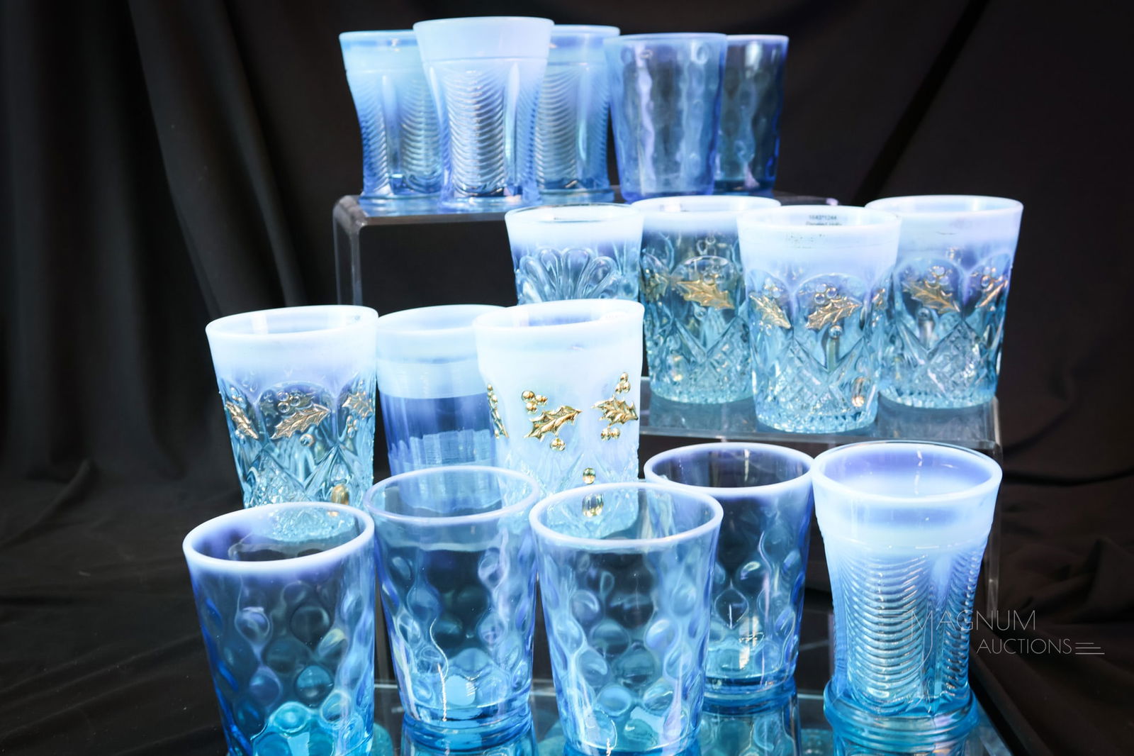 17 pc Victorian Blue Opalescent Glass Tumblers: A more than generous lot of Victorian pressed opalescent glass tumblers in blue. This lot includes patterns such as Drapery, Panelled Holly, Inverted Thumbprint, and more. SHIPPING NOTICE: If you choo