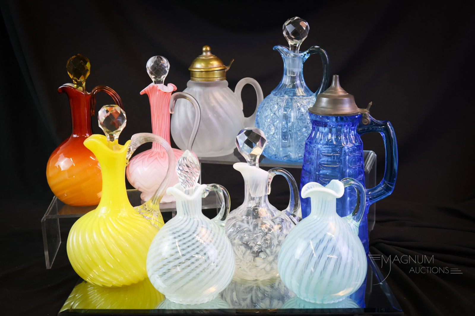 9 pc Lot Victorian Glass Cruets & Syrups: Nine delights that are sure to please in this lot of Victorian glass. This lot includes two syrups and seven cruets. The tallest measures 8 1/2". The blue Hobbs syrup exhibits sickness to the glass an