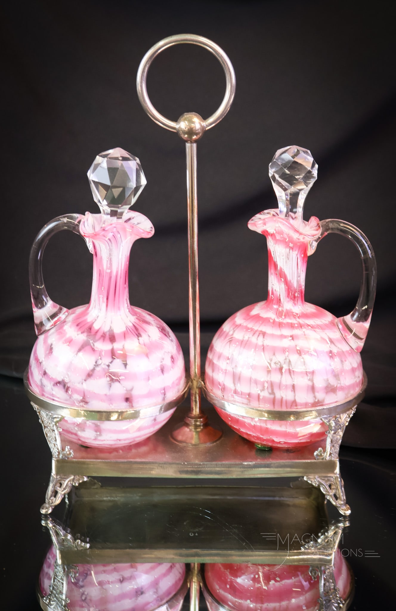 Rare Webster Silverplate Double Phoenix Rings Cranberry Spatter Cruet Set: A rare find in Victorian silverplate and glass. This is a double cruet set in a signed Webster silverplate holder. The cruets are attributed to Phoenix glass in the cranberry spatter Rings pattern. Wi
