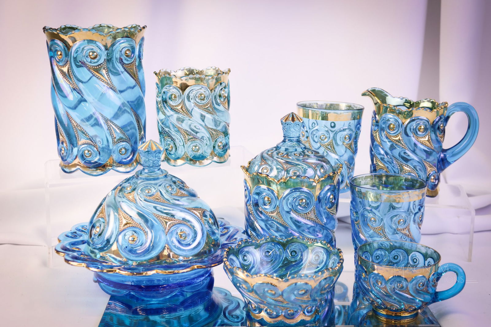 9 pc Lot Dugan S-Repeat Victorian Glass: Nine finds that most will be a delight when you get them. This lot includes a four-piece table set, a celery vase, two tumblers, and a small berry bowl. Each piece is decorated with gold. The tallest