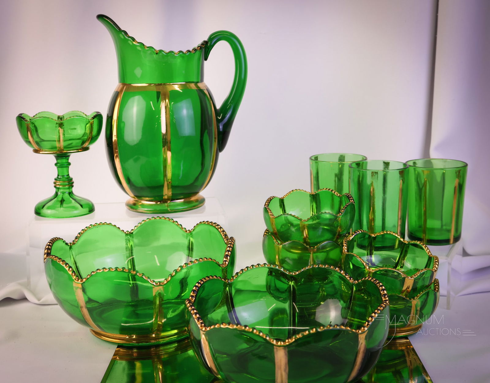 12 pc Lot Riverside X-Ray Victorian Glass: Twelve pieces to delight in this lot of Riverside X-Ray pattern in green with gold. This lot offers a water pitcher and three tumblers, a jelly compote, two large master berry bowls, and five small be