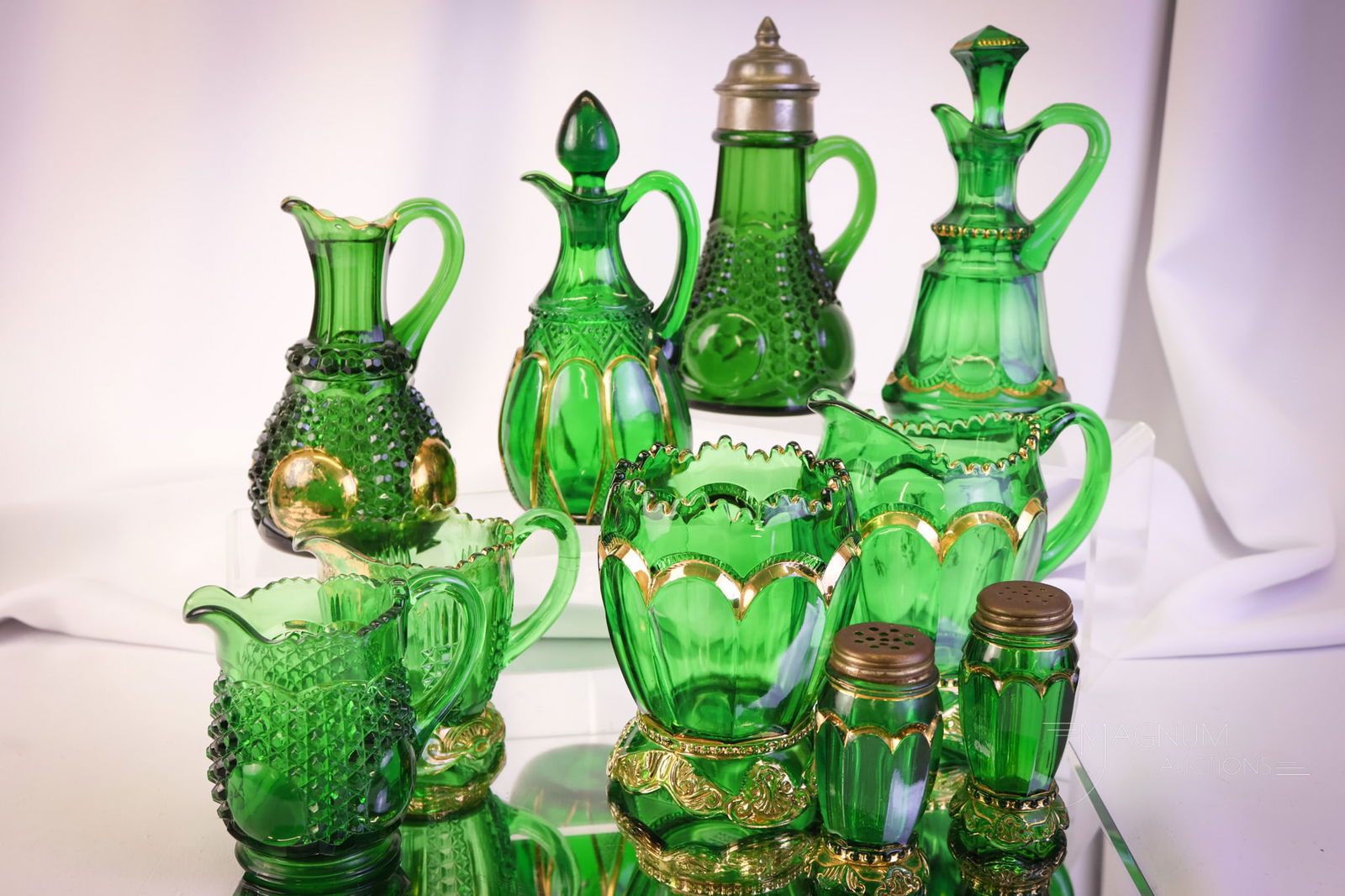 10 pc Lot Riverside Green & Gold Victorian Glass: Ten pleasing pieces of Rioverside Victorian green with gold glass. This lot offers patterns in the Duchess, the Empress, and more patterns. The tallest measures 7". The Duchess cruet stopper exhibits