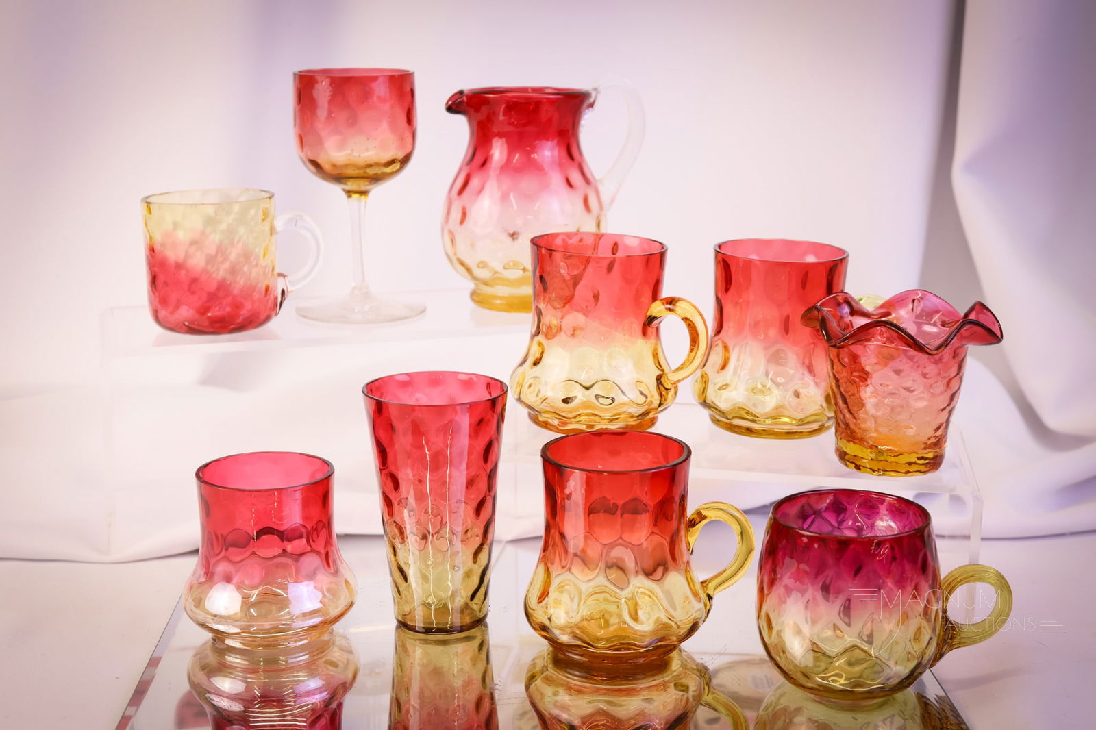 10 pc Lot Victorian Amberina Glass: This lot combines six assorted punch cups with a toothpick holder, a juice glass, and a single stem. The tallest measures 4 3/4". SHIPPING NOTICE: If you choose not to utilize the LiveAuctioneers Live