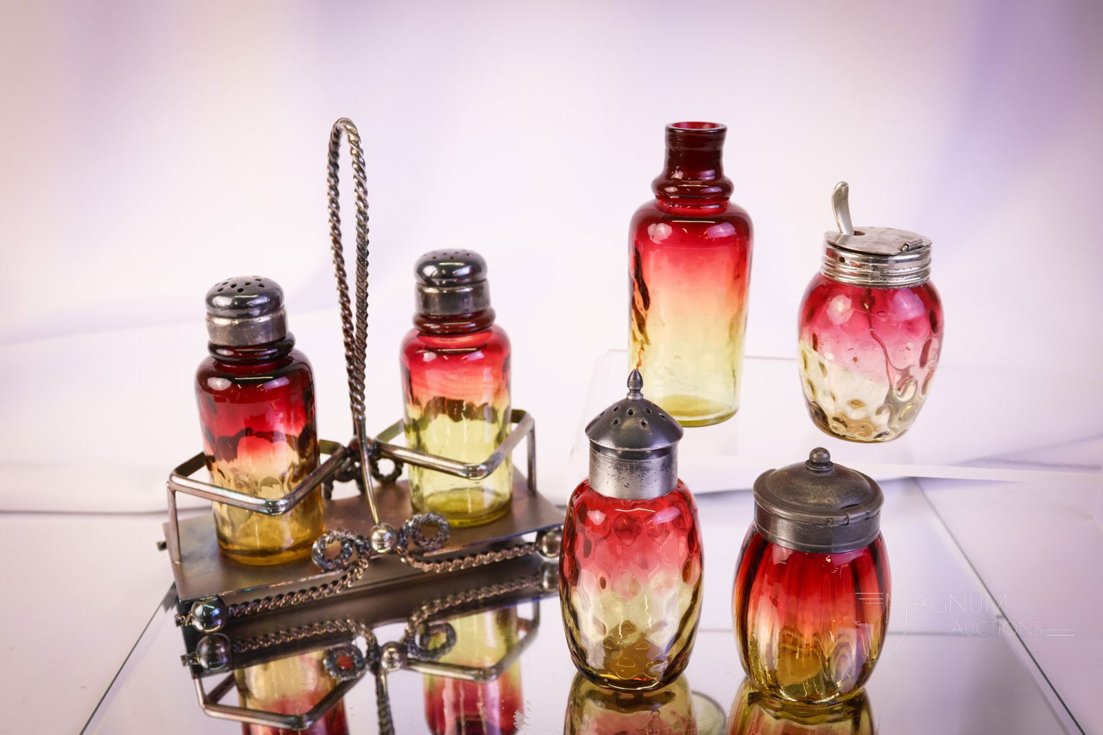 6 pc Lot Victorian Mt. Washington New England Art Glass Amberina Shakers & More: Six delights in amberina Victorian glass from such notable makers as Mt. Washington and New England glass. This lot includes a pair of shakers in a Meriden silverplate holder. A barrel shaker and an I