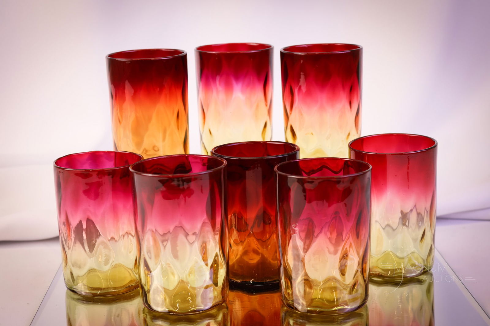 8 pc Lot Mt. Washington Amberina Victorian Glass Tumblers: Eight beautiful examples of Mt. Washigton diamond-quilt Victorian tumblers. The tallest measures 3 3/4". SHIPPING NOTICE: If you choose not to utilize the LiveAuctioneers LiveShip program, MAGNUM AUCT
