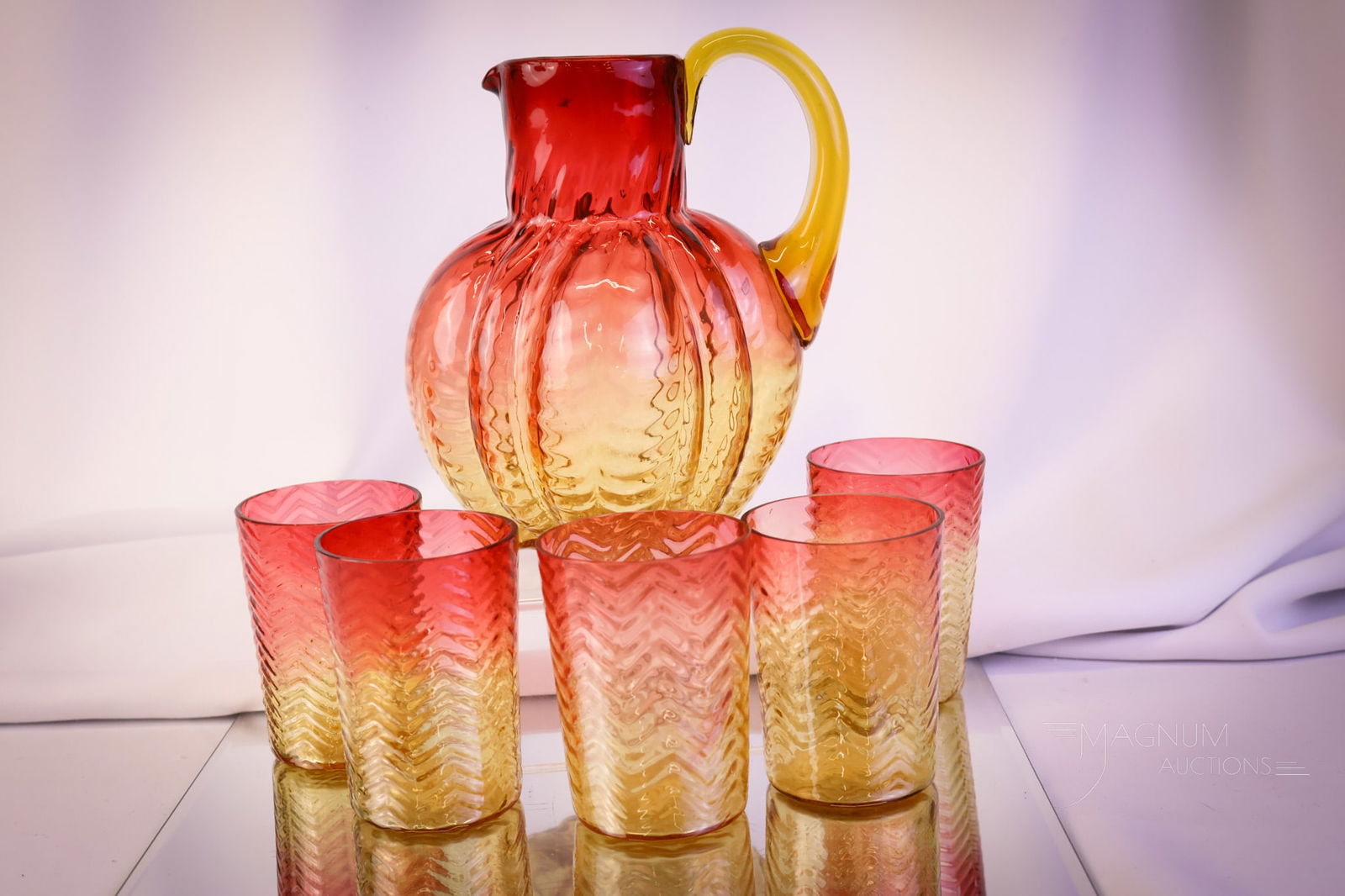 5 pc Phoenix Victorian Amberina Art Glass Herringbone Water Set: A wonderful, complete five-piece set of amberina Victorian glass. This set is in the Herringbone pattern. The set includes a pitcher and four tumblers. The tallest measures 7 1/2". SHIPPING NOTICE: If