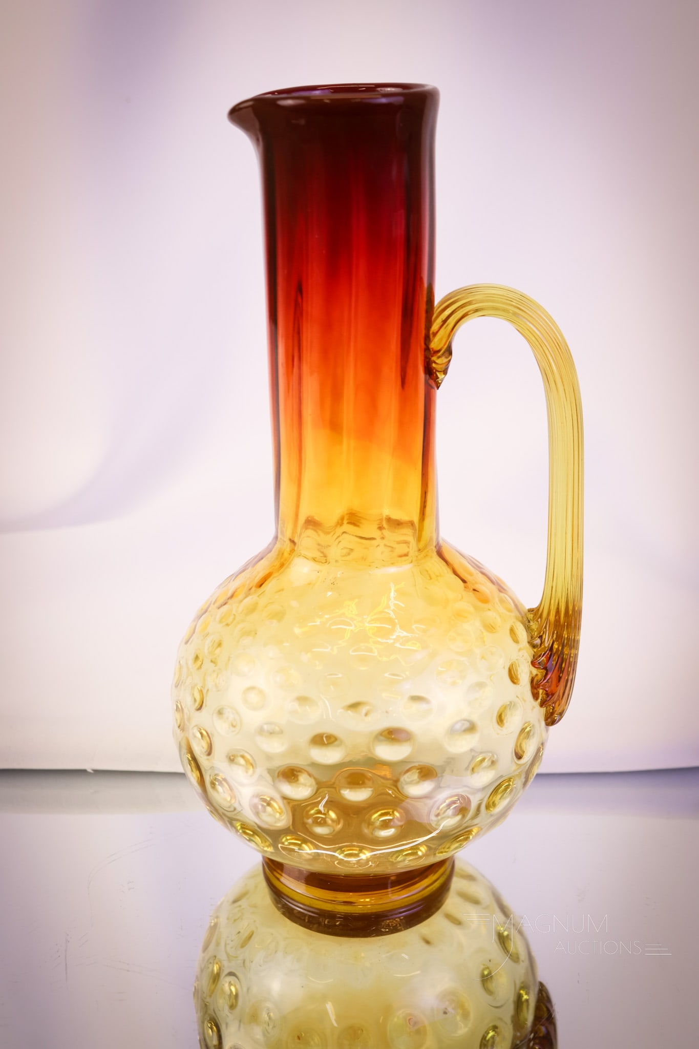 Very Rare Mt. Washington Victorian Amberina Glass Hobnail Tankard Pitcher: A very rare find in Victorian Mt. Washington amberina glass. This is a hobnail and ribbed pattern tankard pitcher. Such a wonderfully rare piece. This one measures 9 3/4" tall. Provenance: This item