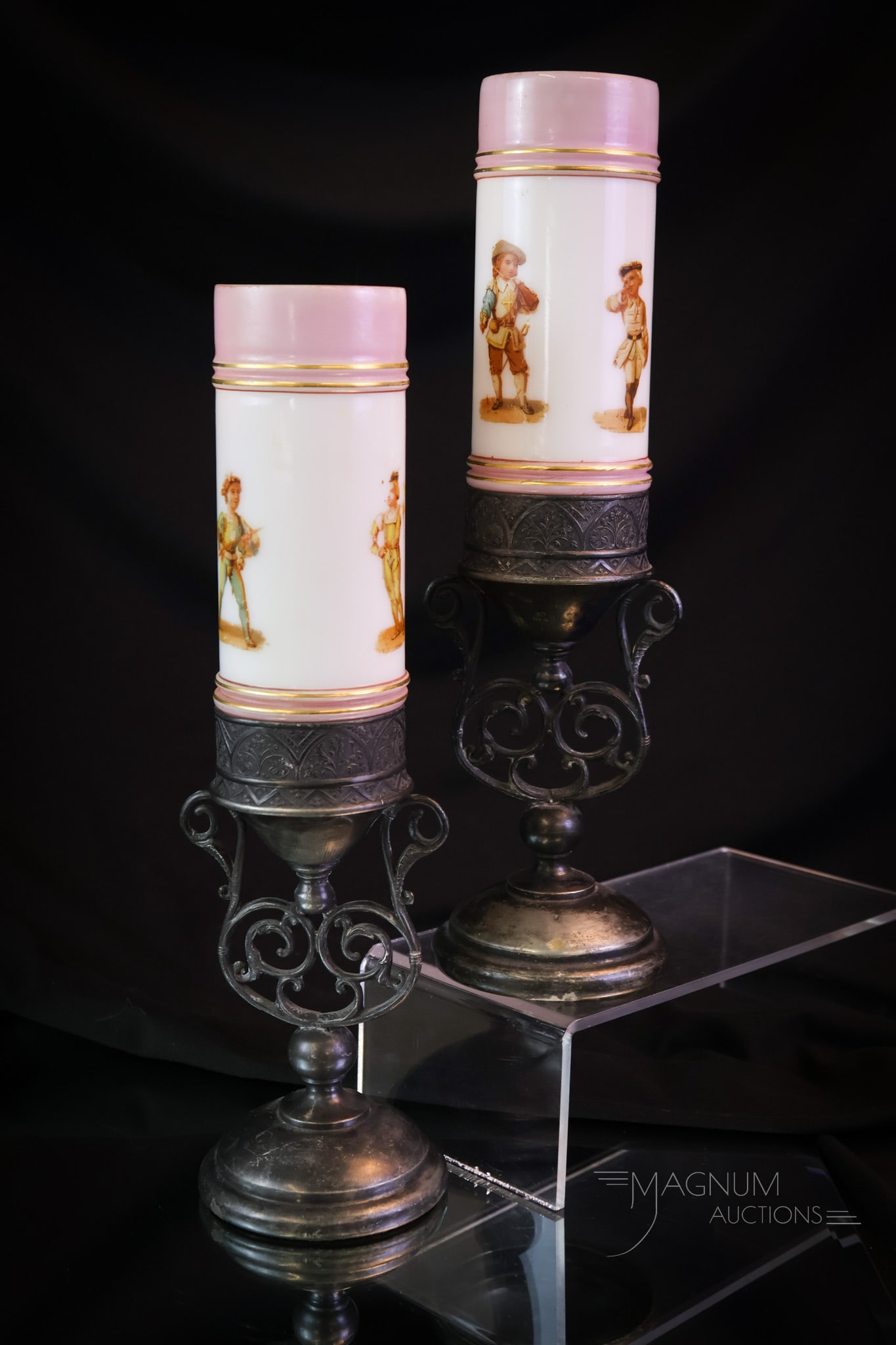 Pair of Smith Bros. Victorian Glass Silverplate Decorated Cylinder Vases: A fine offering of a pair of Victorian cylinder vases by Smith Bros. Each are decorated with children in Victorian garb. These reside in unmarked silverplate holders. Each measures 11 3/4" tall. SHIPP
