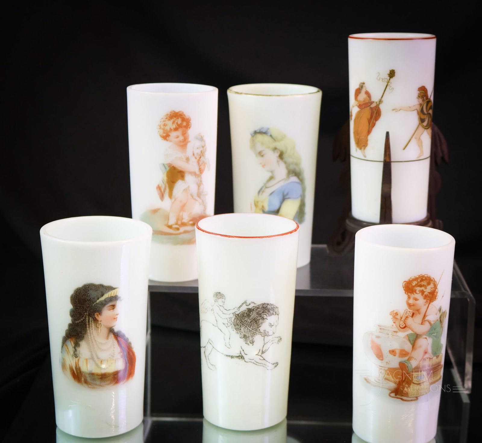 6 pc Lot Smith Bros. Victorian Glass Cylinder Vases: A six-piece lot of Victorian glass cylinder vases with figural decoration. There is a pair of opposing female portrait-type decorations. A pair with a children's theme. These and more. The tallest mea