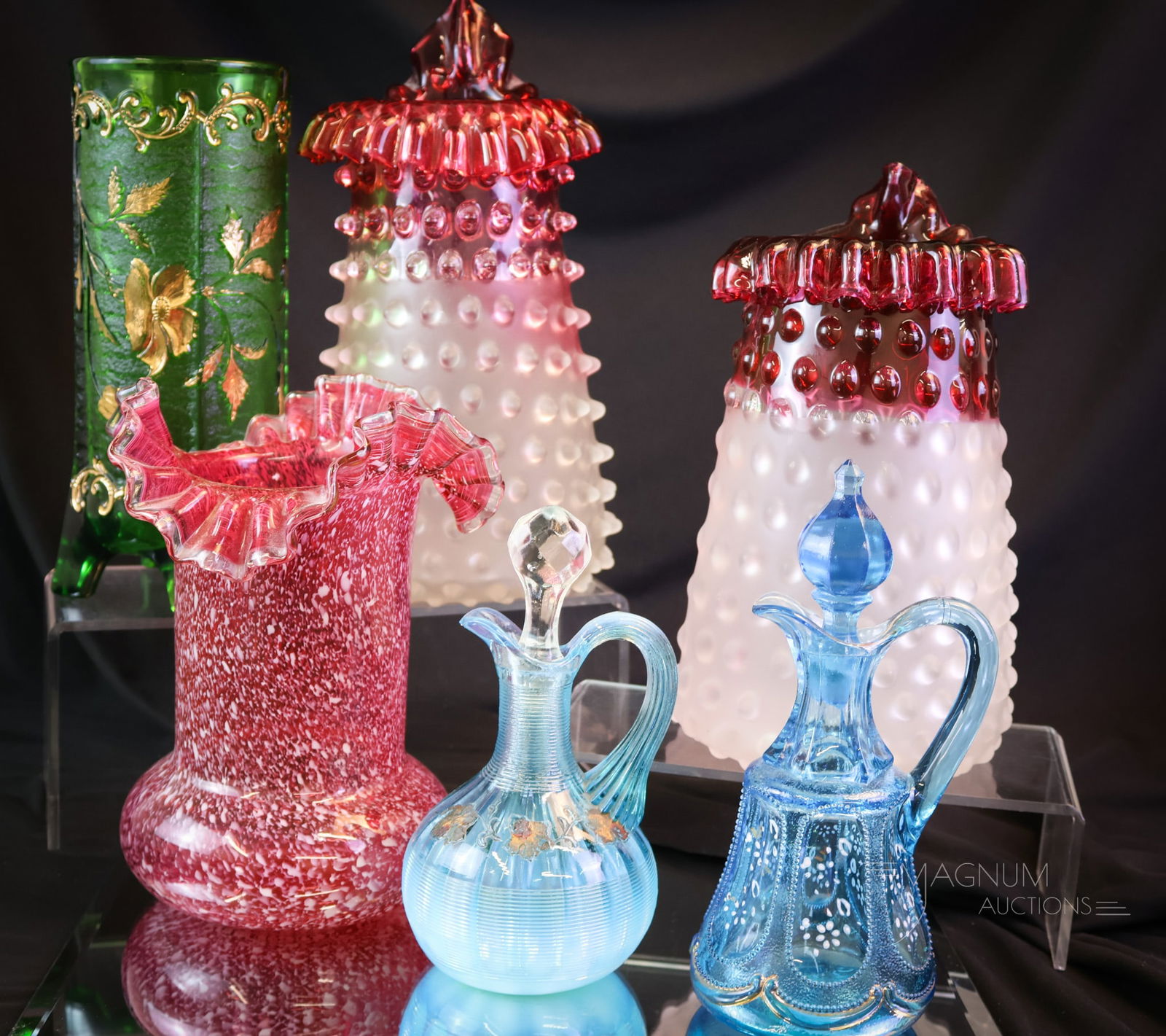 6 pc Lot Art & Pattern Glass: Six desirable finds for the Victorian glass collector. This lot includes two Hobbs Hobnail pattern cranberry to clear rubina mantle vases. A spatter glass ruffled vase. A green Floradora vase. Lastly,