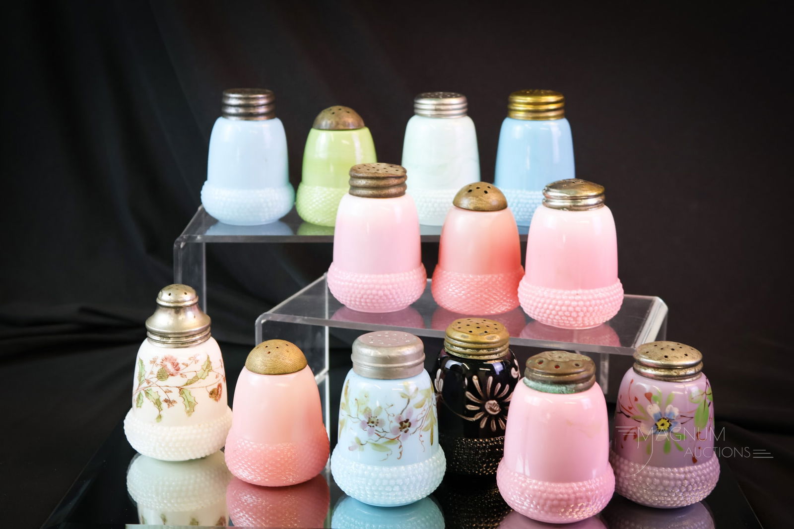 13 pc Victorian Opaque Glass Salt Shakers: A substantial lot of opaque glass Victorian acorn salt shakers in an assortment of colors. The tallest measures 3 1/4". SHIPPING NOTICE: If you choose not to utilize the LiveAuctioneers LiveShip progr