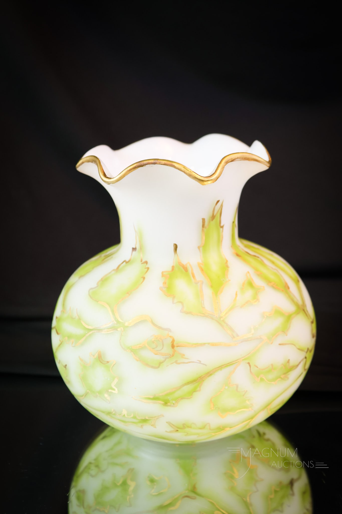 Harrach Victorian Art Glass Airtrap Inlay Glass Vase: A wonderfully rare find in Victorian art glass. This is an inlay airtrap floral pattern of green foliage with gilt outlined decoration on a snow white ground. The vase measures 5 1/2" tall. SHIPPING N