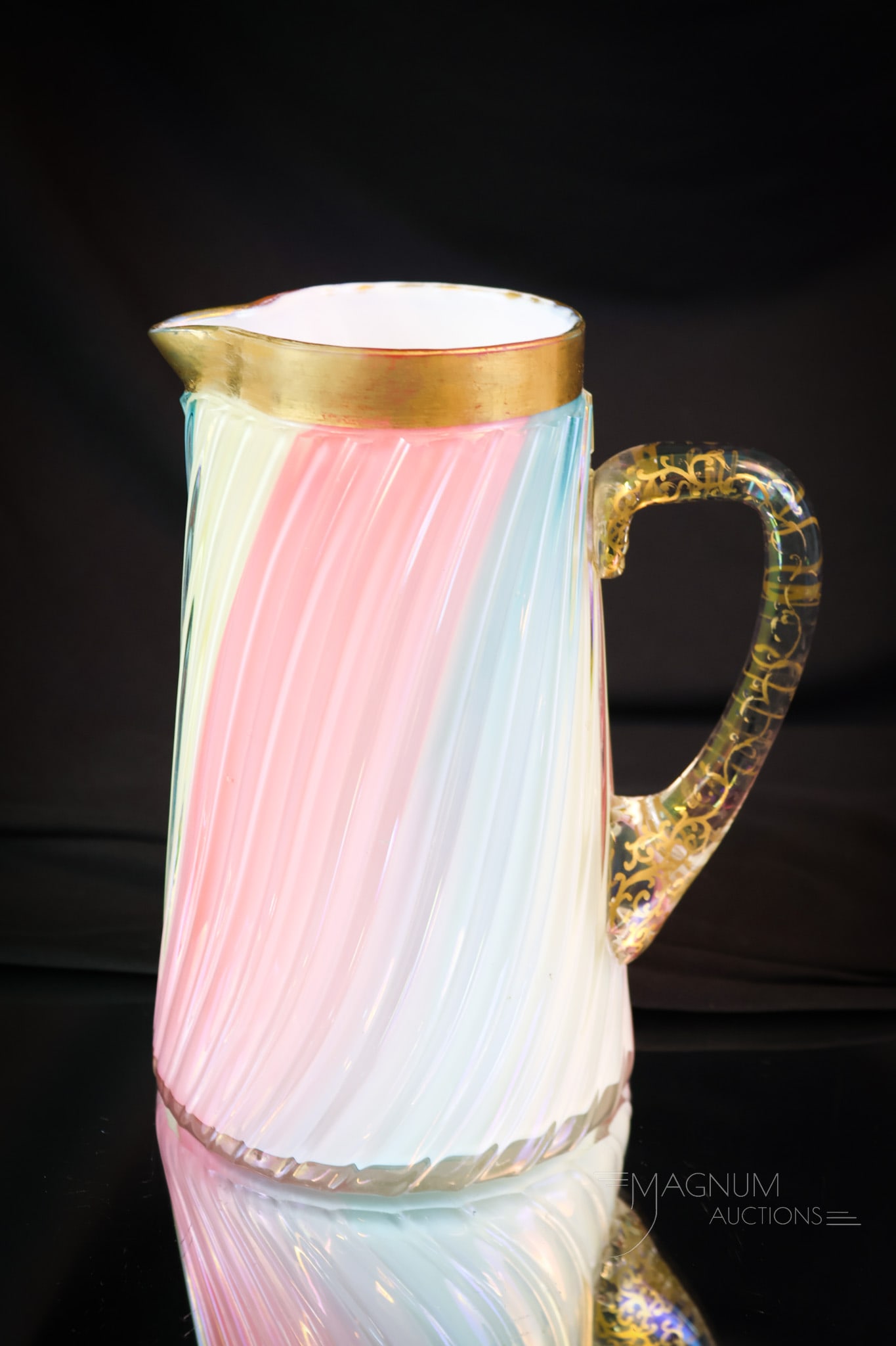 Loetz Rainbow Uranium Cased Art Glass Tankard Water Pitcher: A wonderful Loetz rainbow-cased glass tankard water pitcher. This super example is a rare find and has gilt decoration on the rim and the handle. The piece is signed on the base, "R&B, Co." The pitche