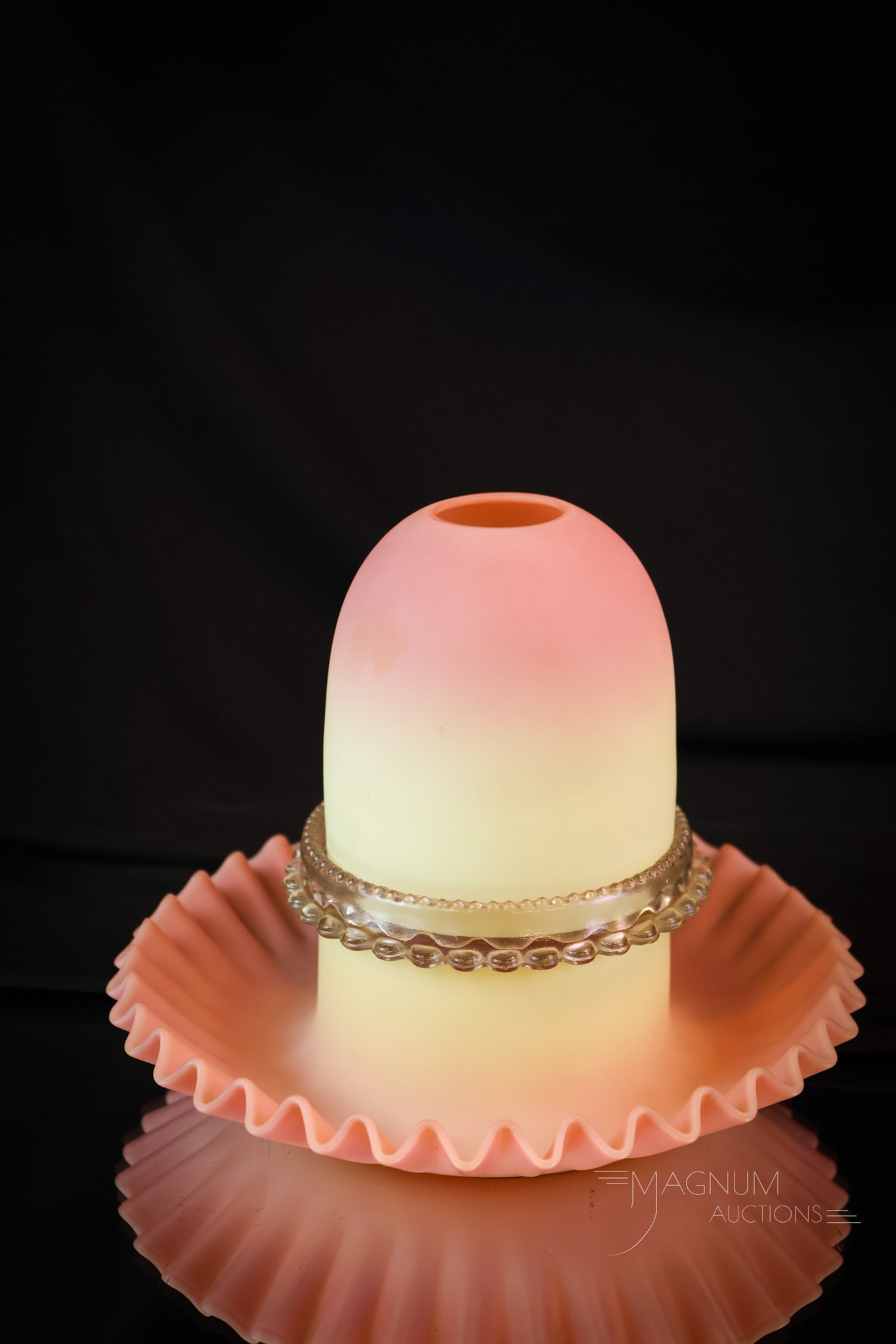 Webb Burmese Victorian Uranium Glass Fairy Lamp: A wonderful find in a Victorian burmese glass fairy lamp. This super example glows brightly under black light with its uranium content. The lamp measures 6" tall. The candle cup exhibits a single toot